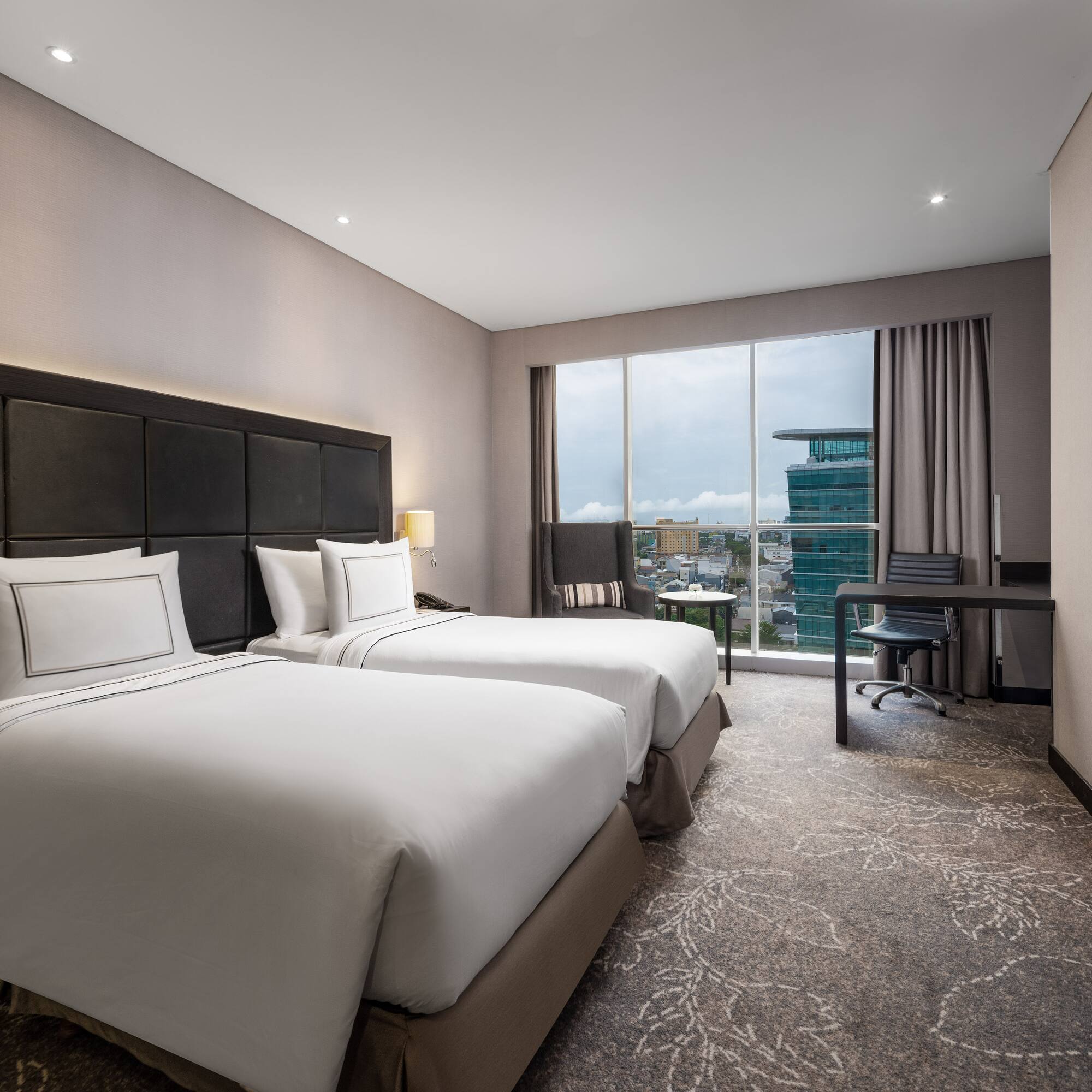 a hotel room with two beds