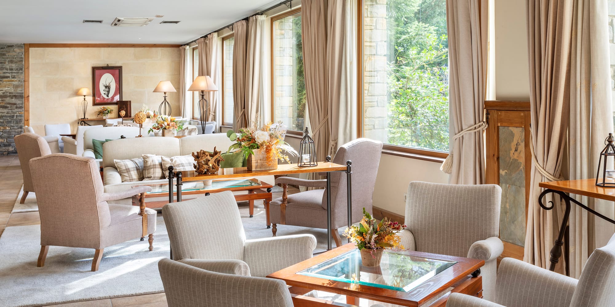 a room with a couch and chairs