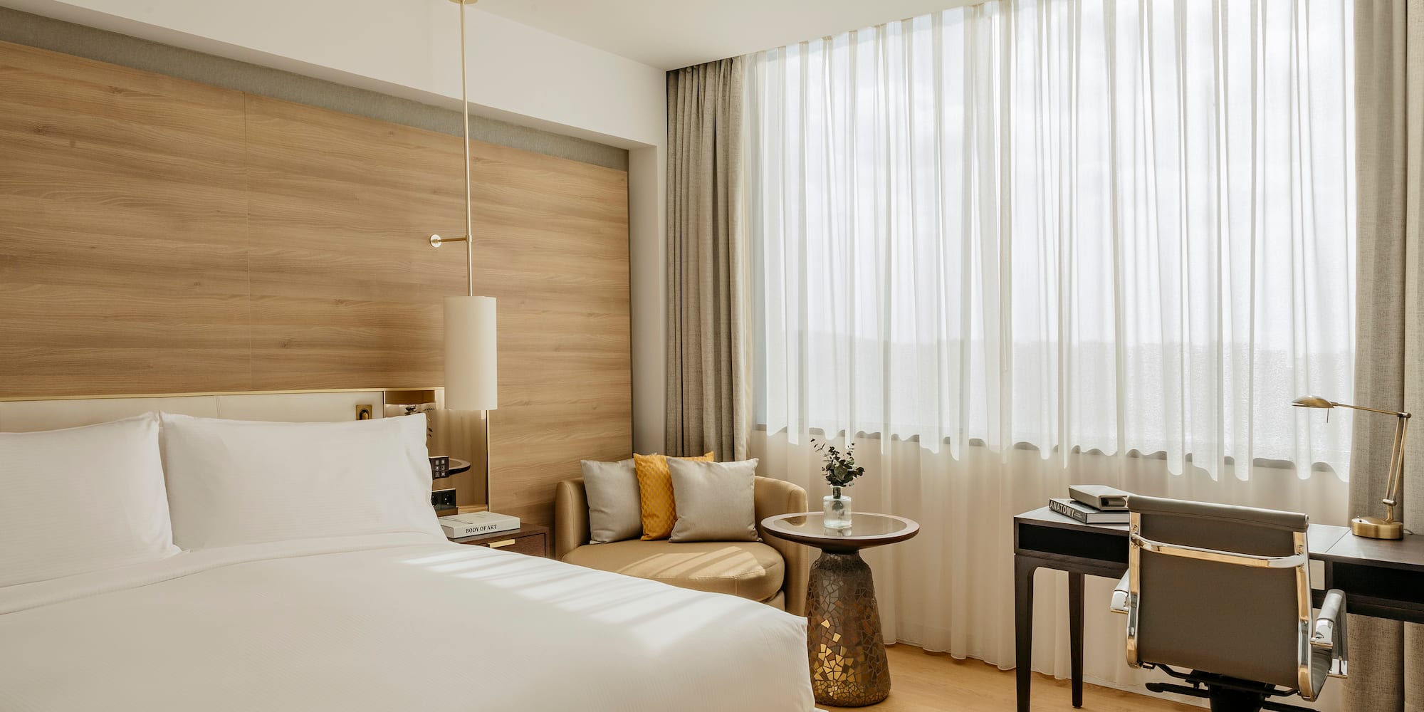 a room with a bed and a desk