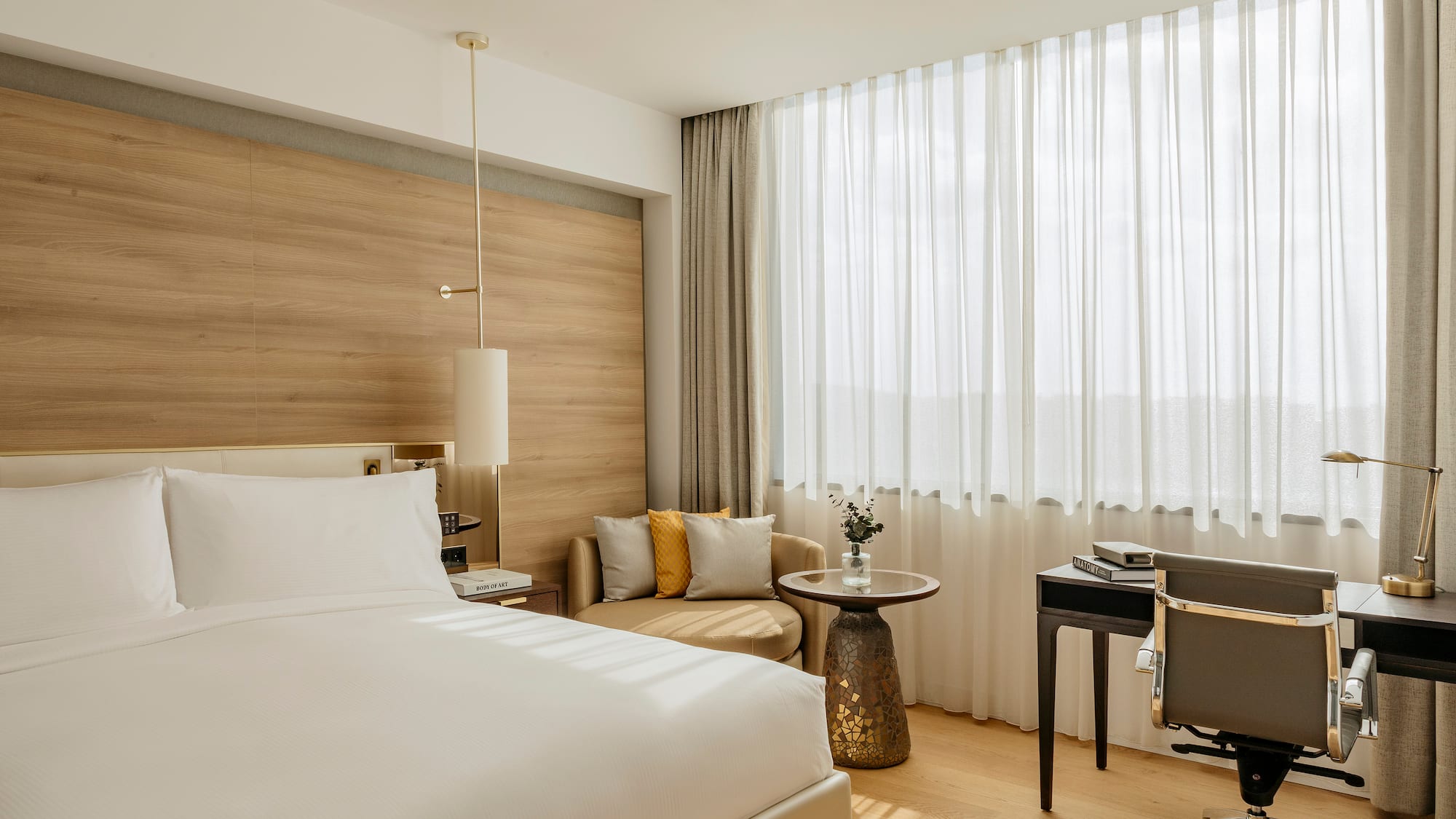 a room with a bed and a desk