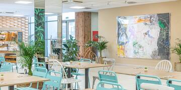 a room with tables and chairs