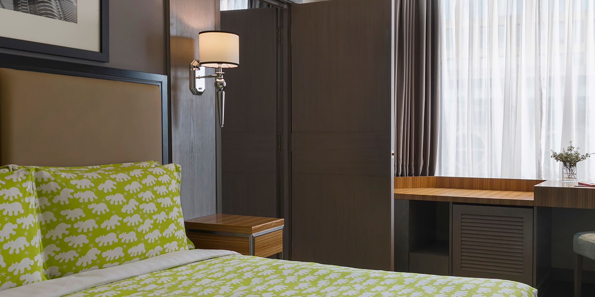 a room with a bed and a desk