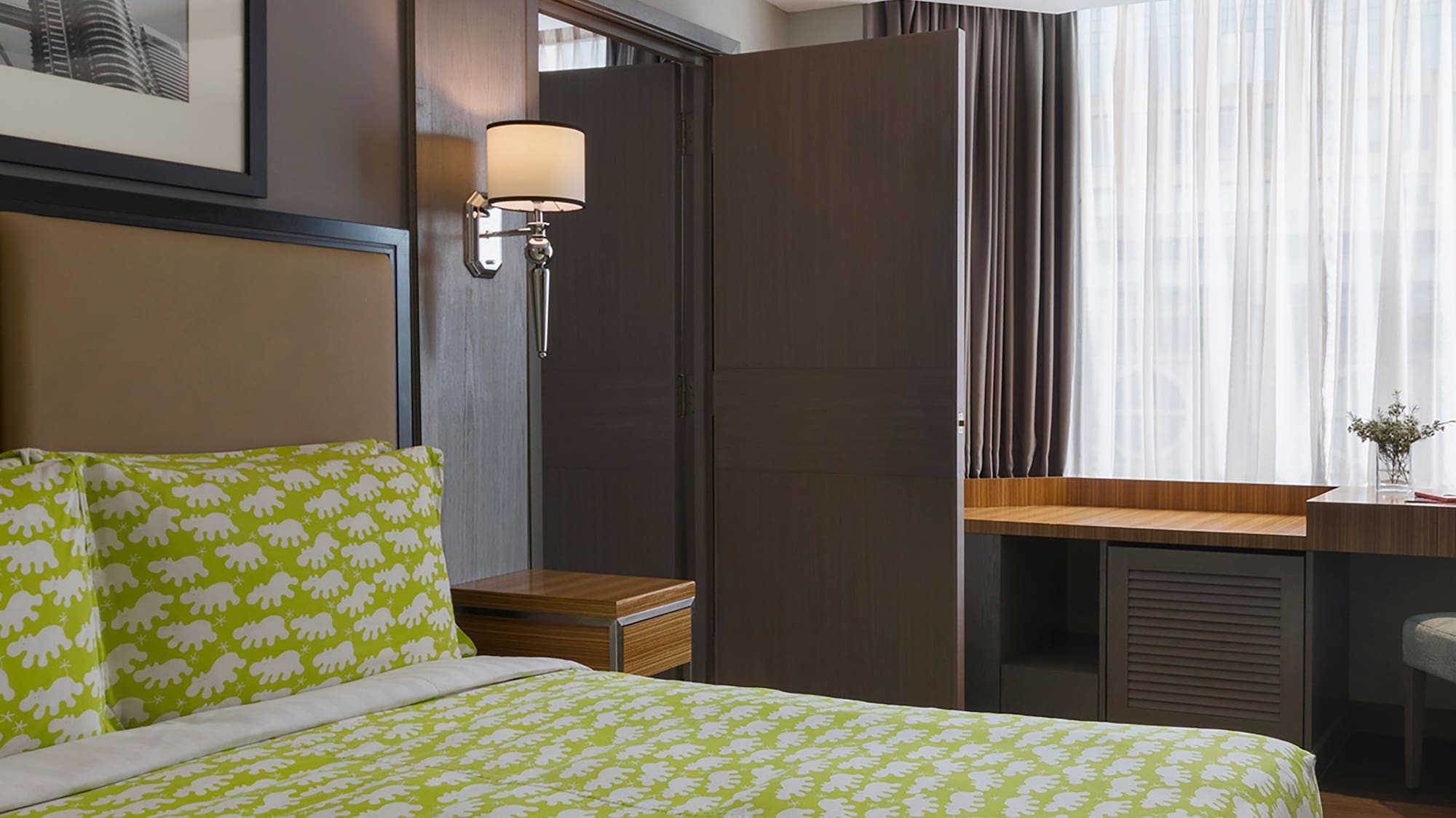 a room with a bed and a desk