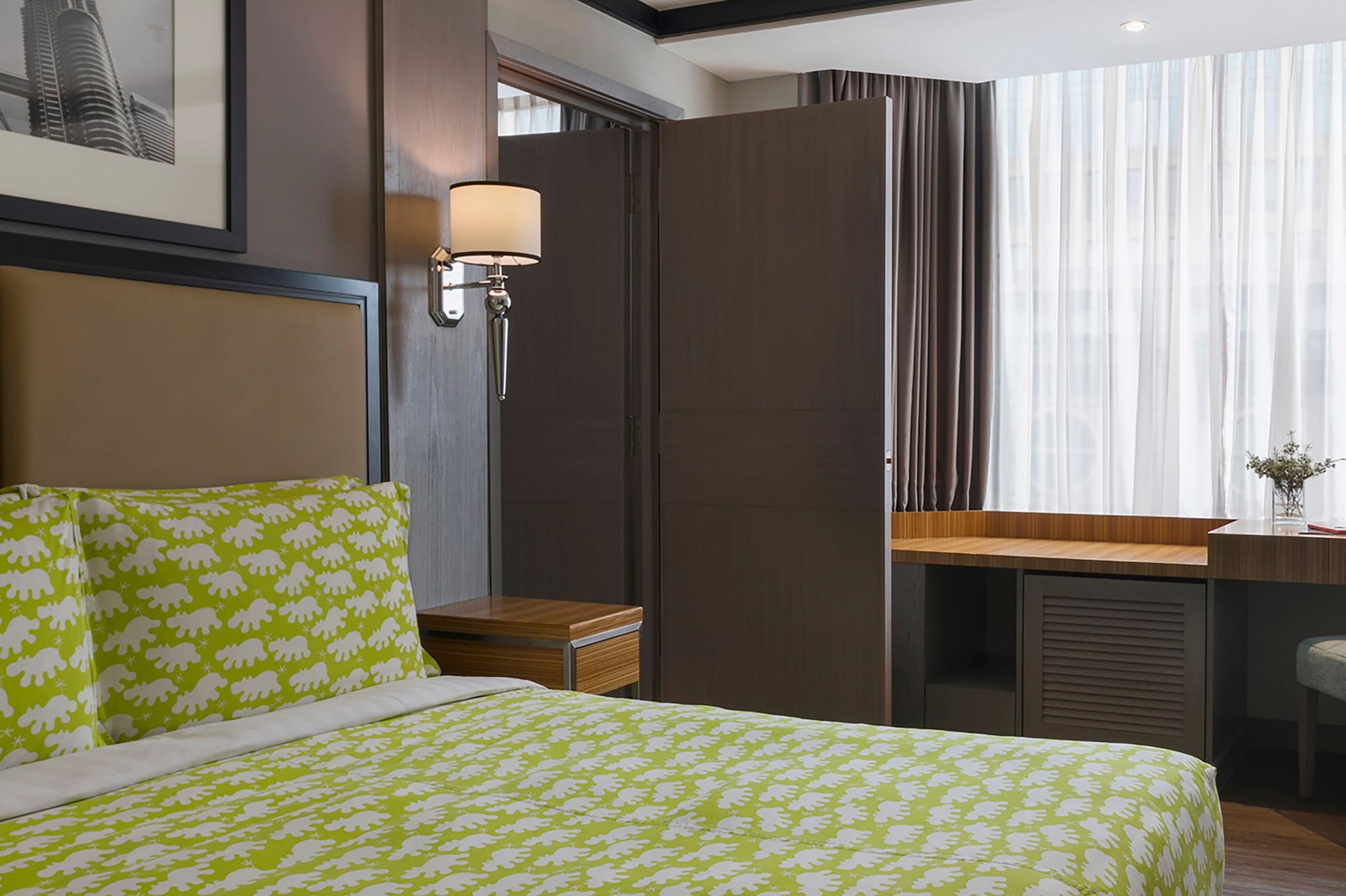 a room with a bed and a desk