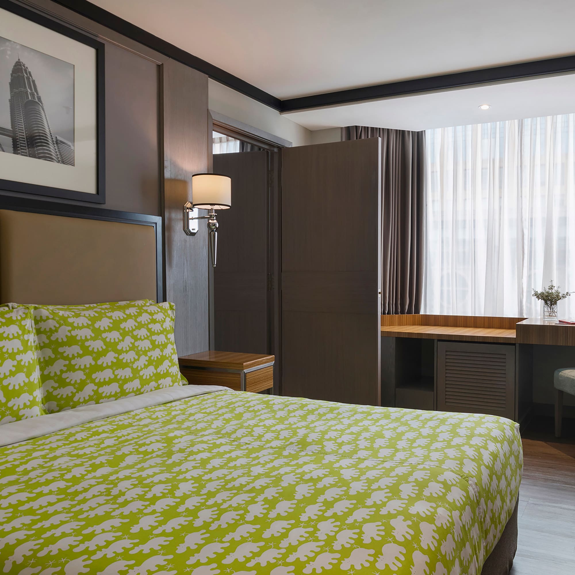 a room with a bed and a desk