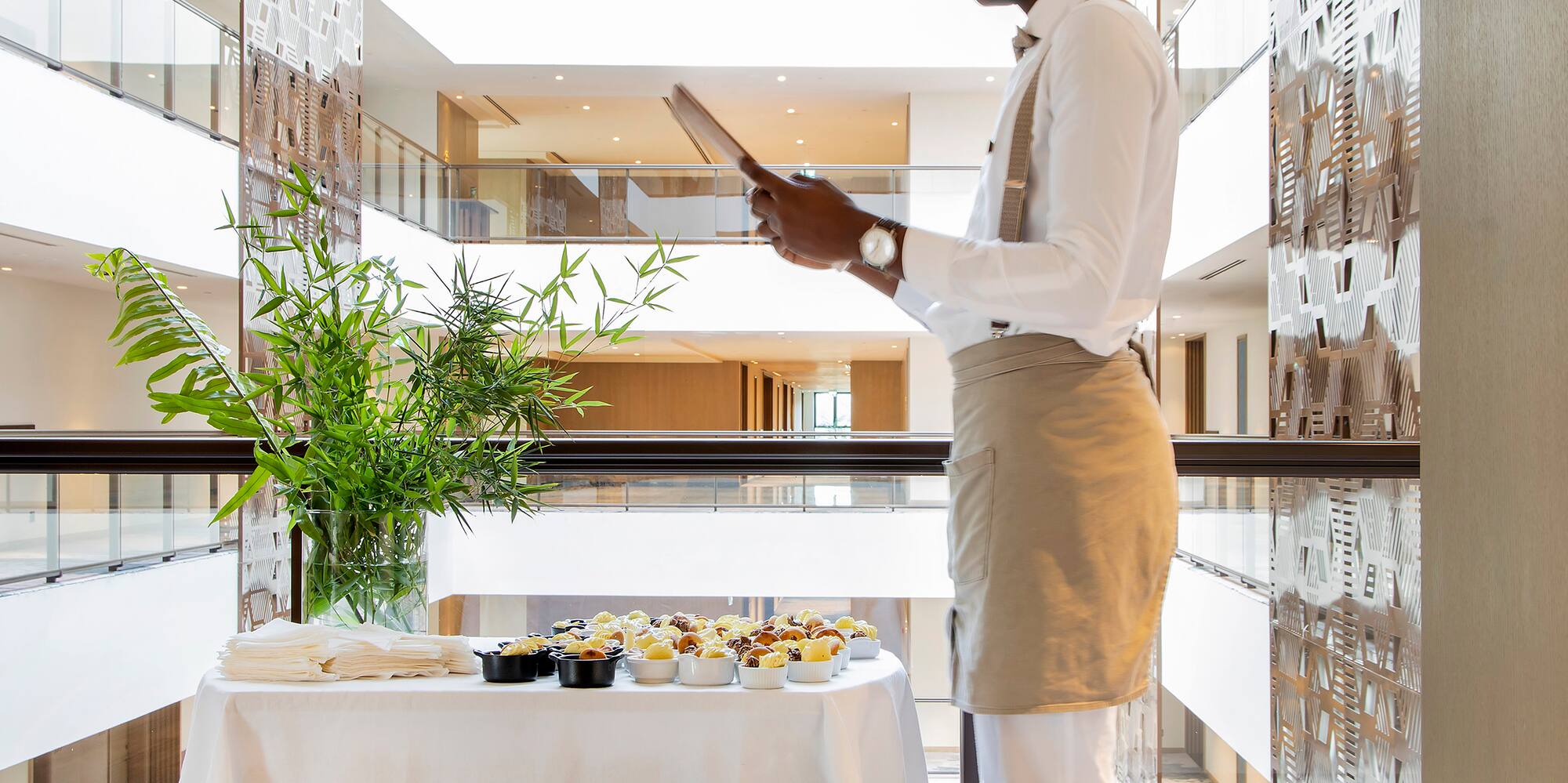 a man standing in front of a table with food on it