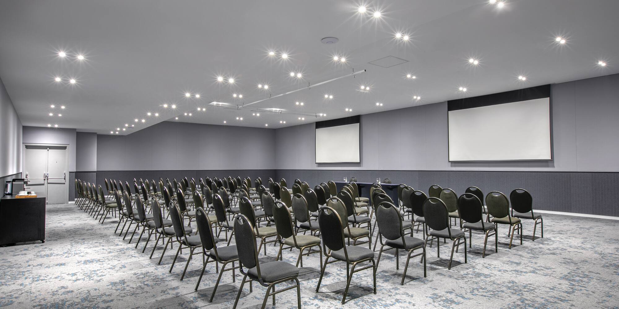 a room with rows of chairs