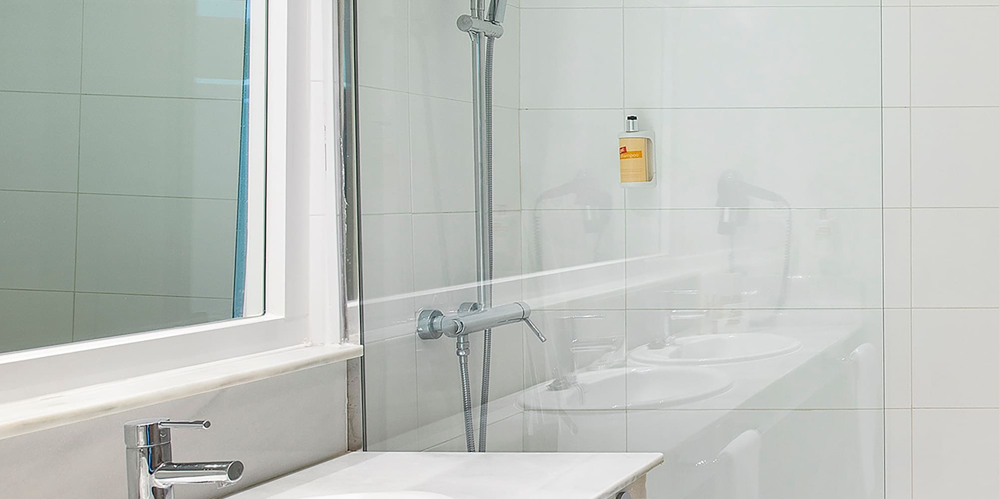 a bathroom with a shower and sink