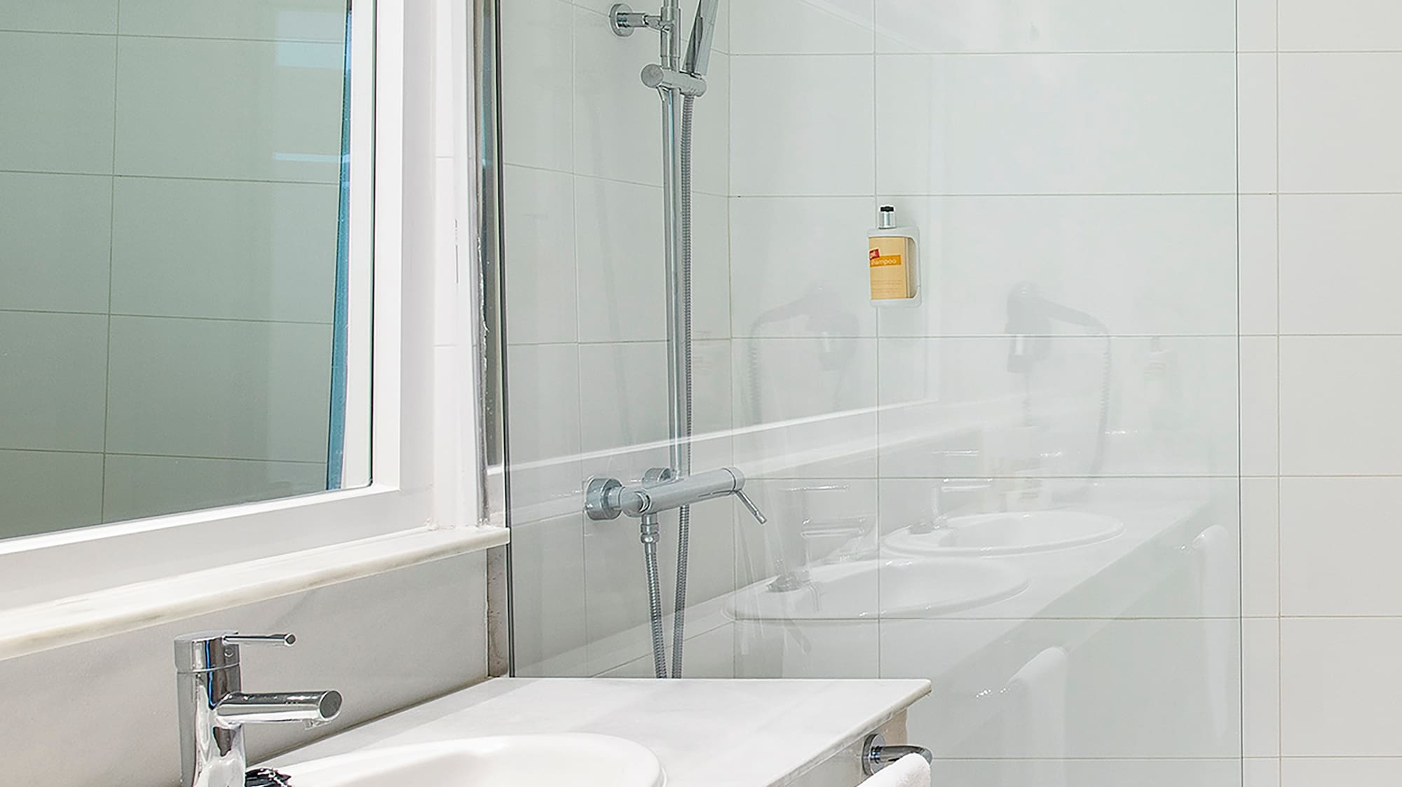 a bathroom with a shower and sink