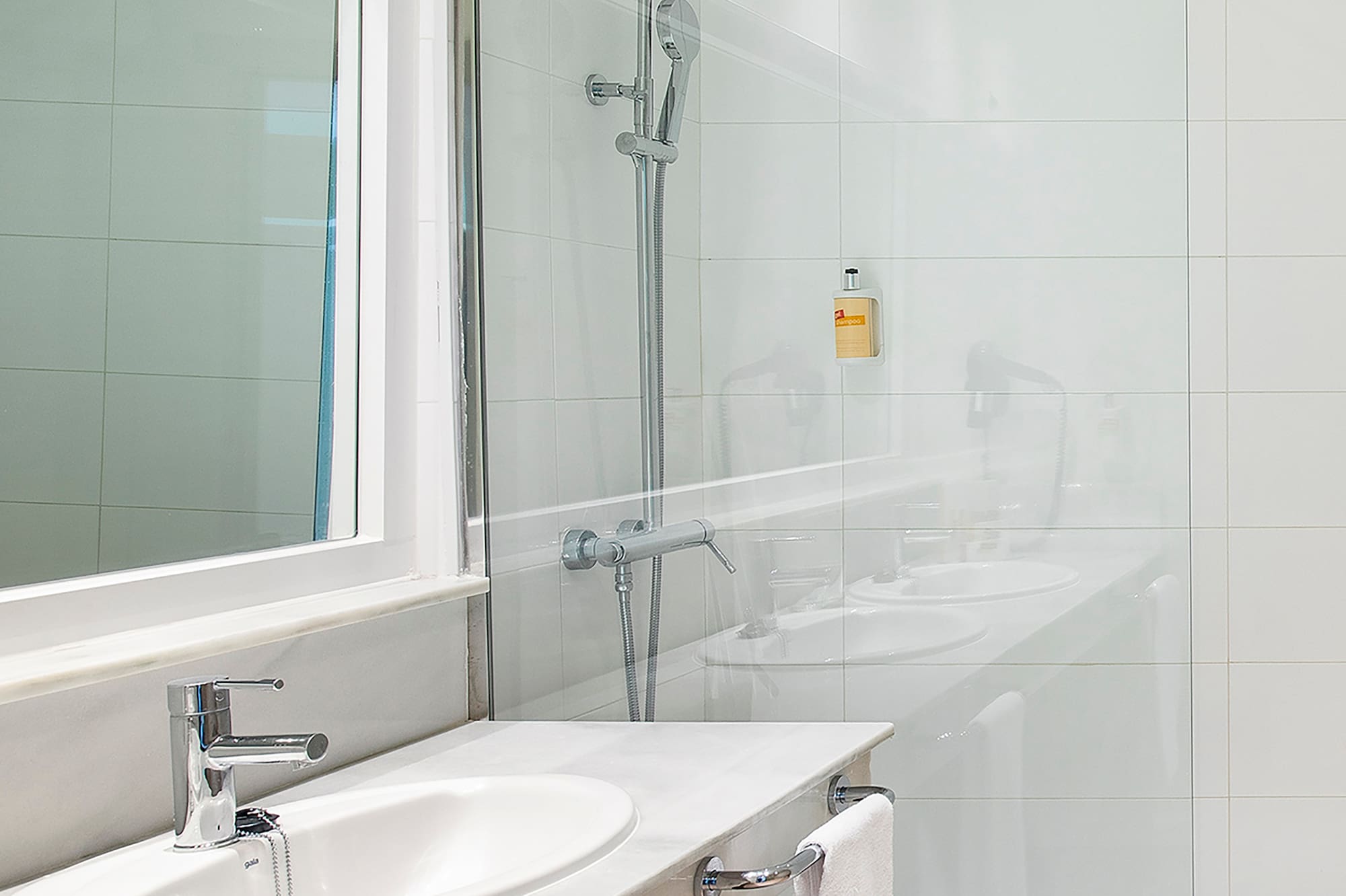 a bathroom with a shower and sink