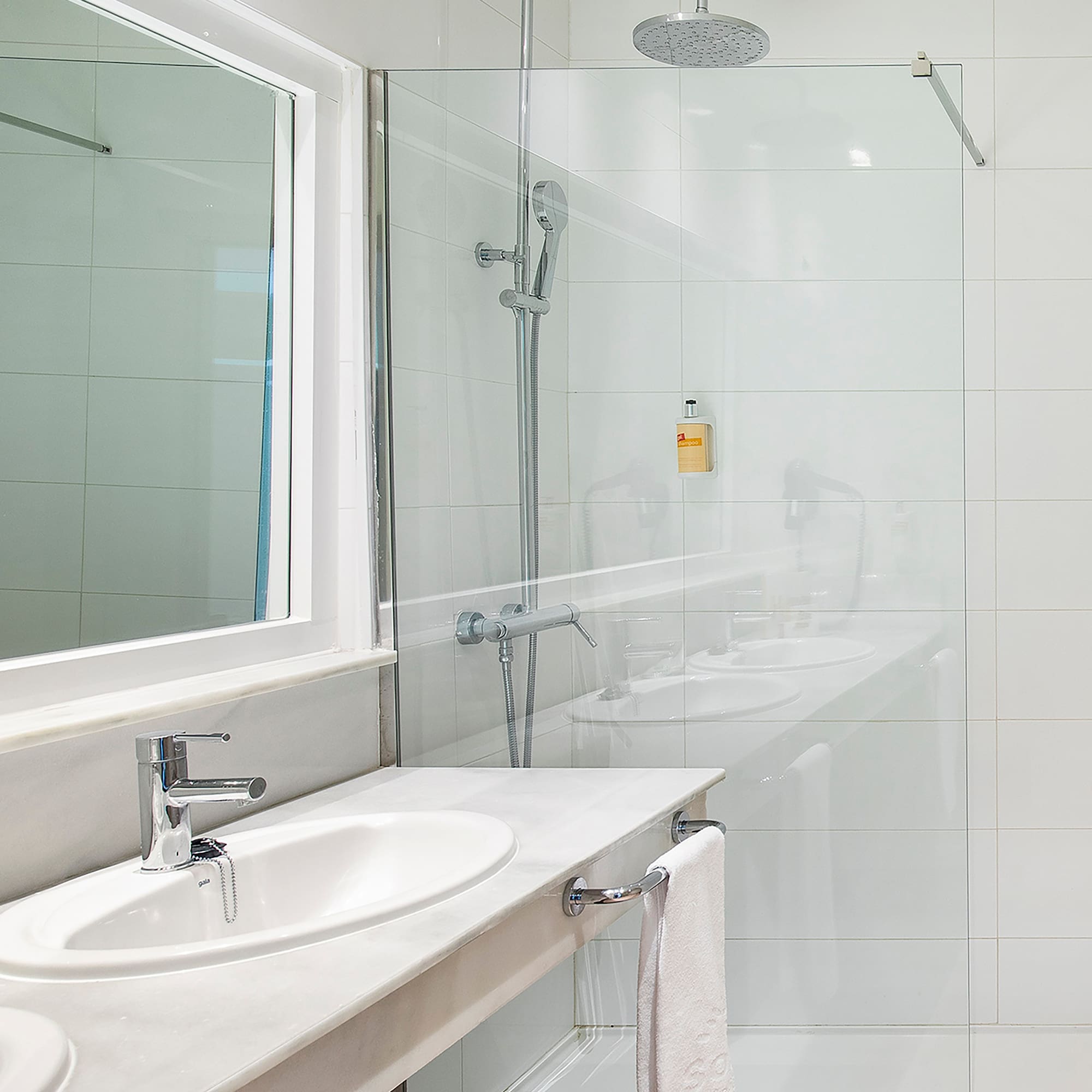 a bathroom with a shower and sink