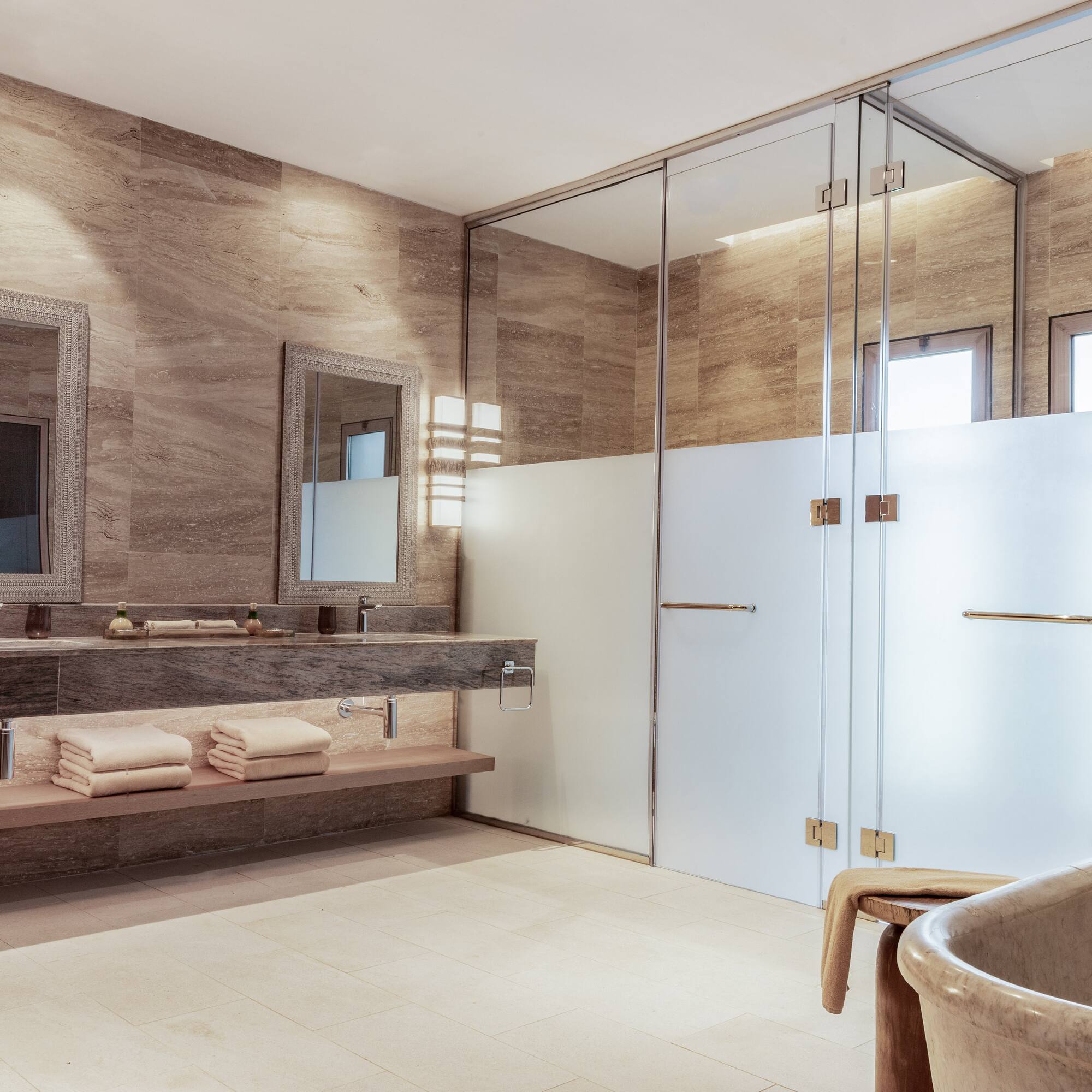 a bathroom with a tub and a shower