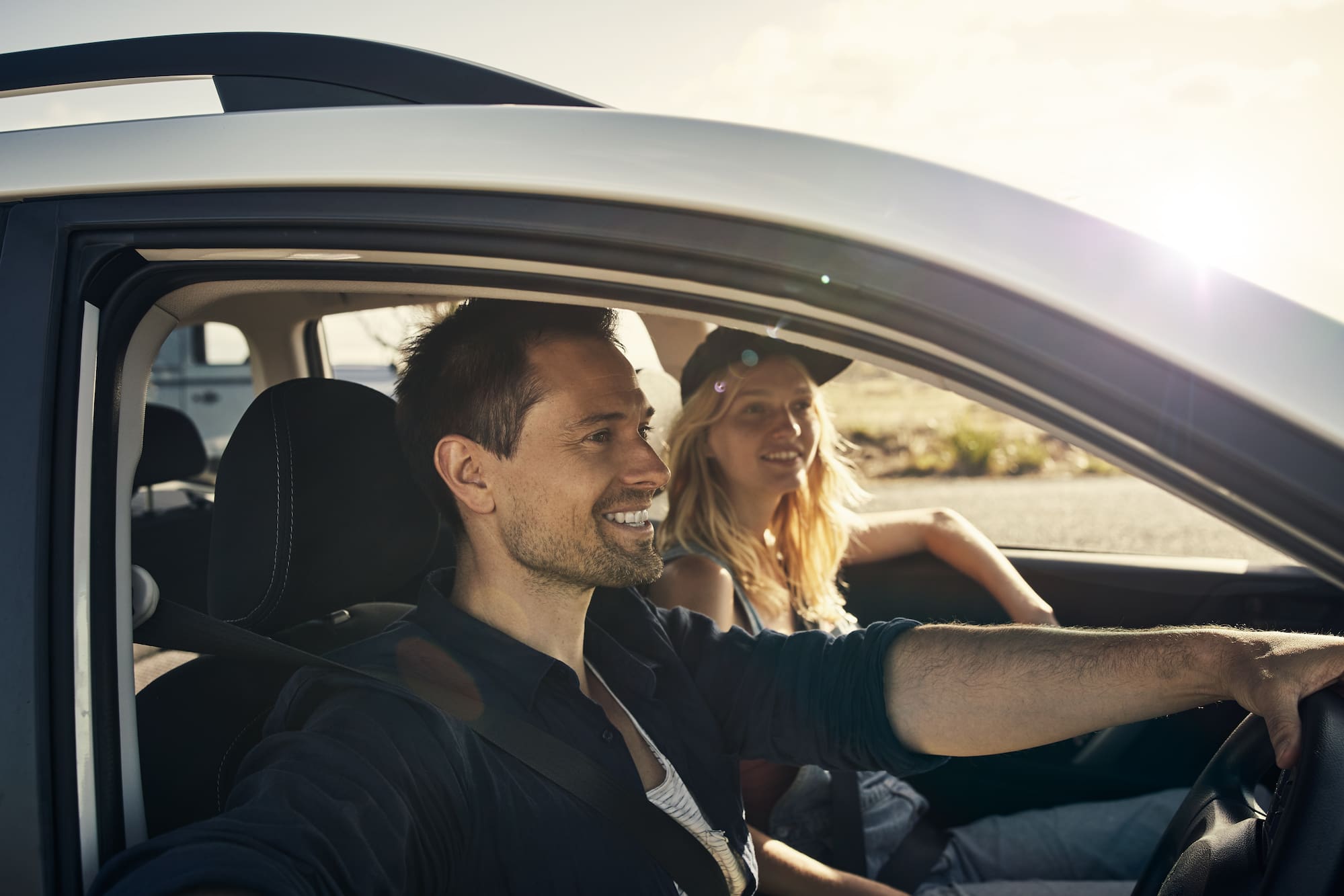 a man and woman in a car