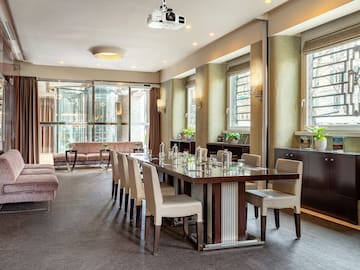 a room with a table and chairs