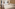 Modern hotel room with two beds, crisp white linen, and wood floor.