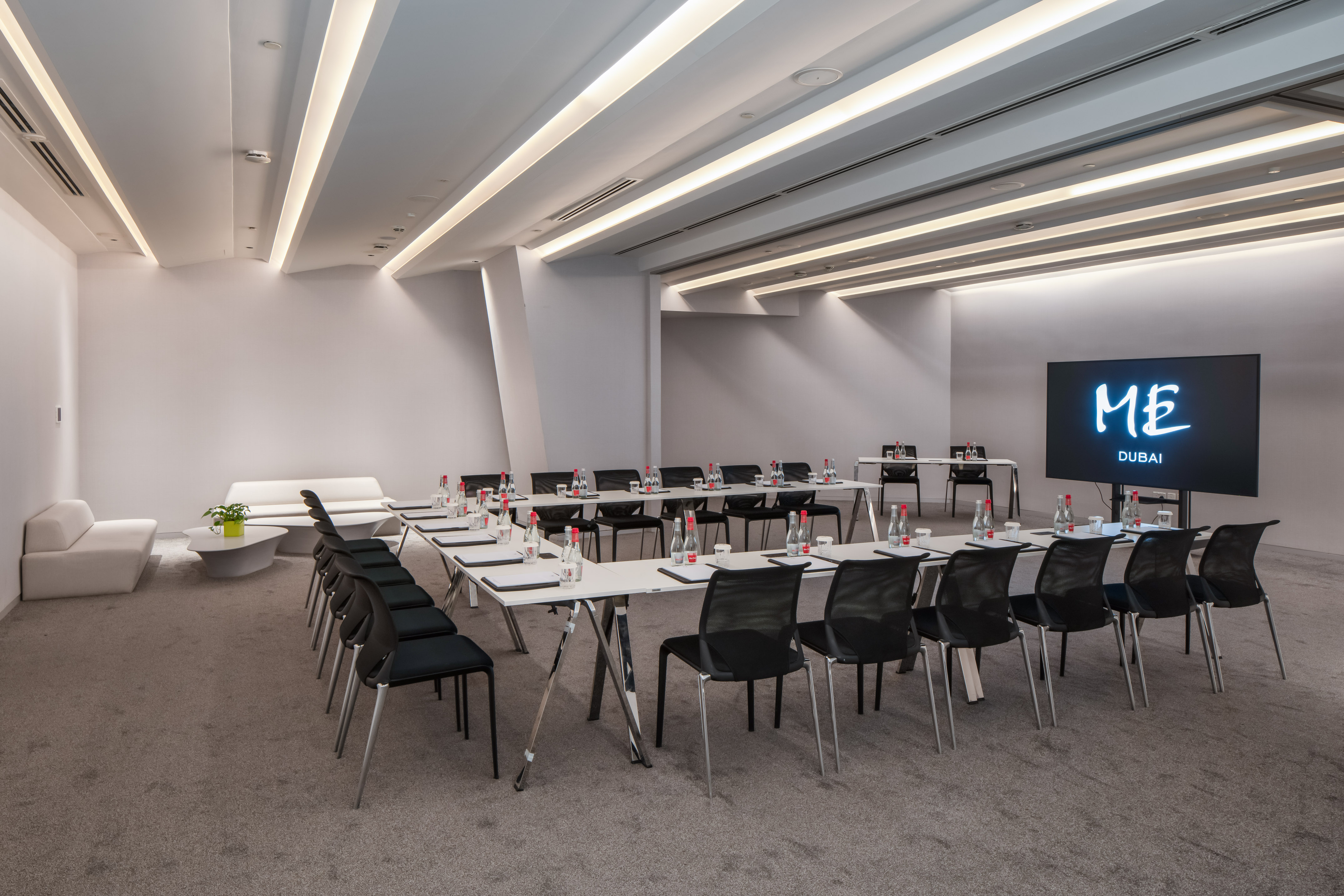 Modern U-shape meeting room setup for corporate events at ME Dubai.