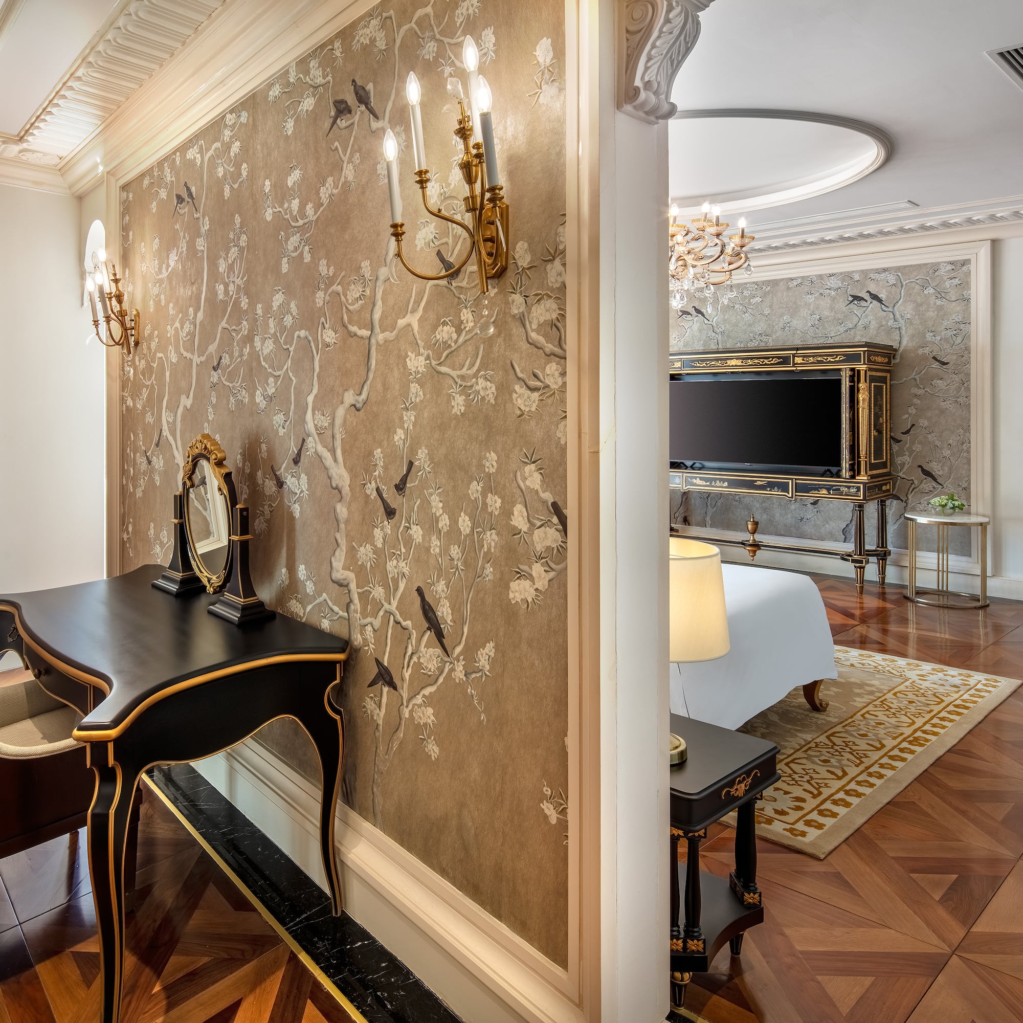 a room with a mirror and a bed