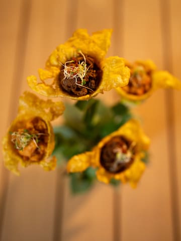 a yellow flowers with sprouts on them