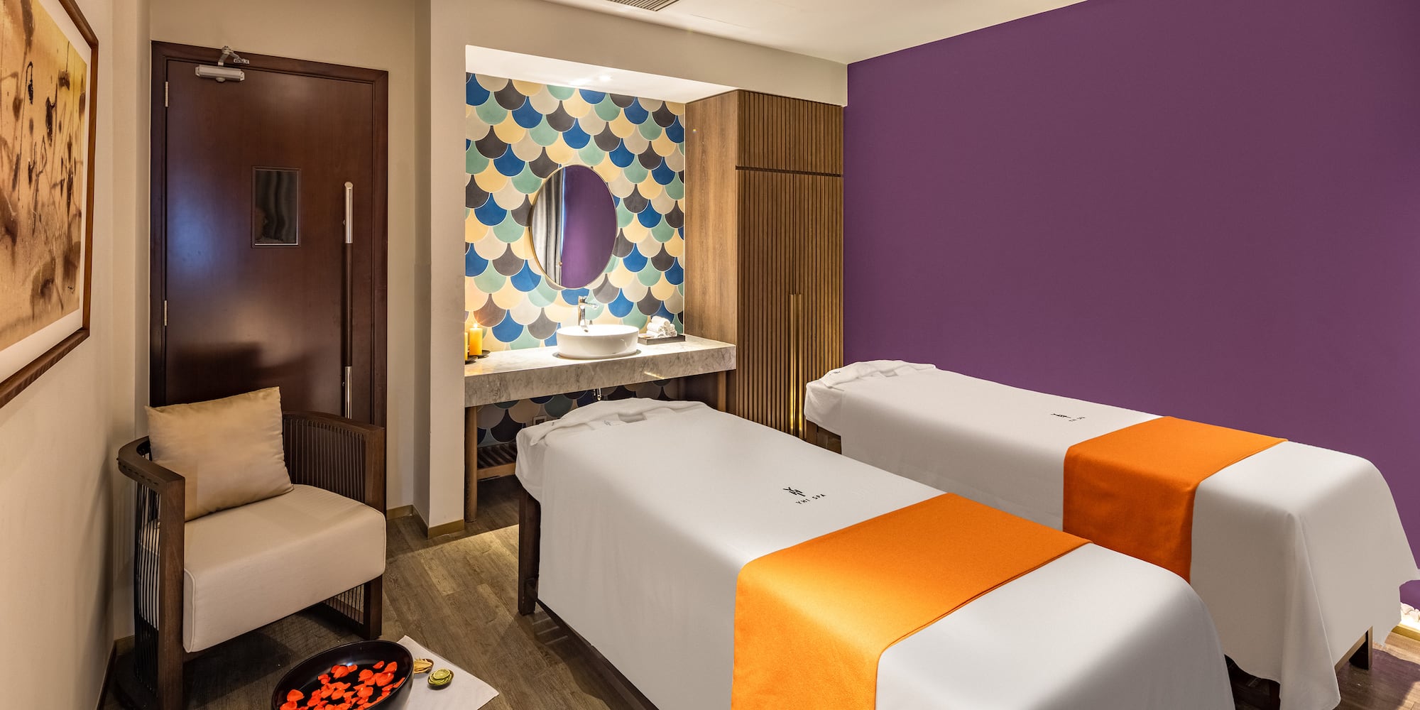 a room with two beds and a mirror