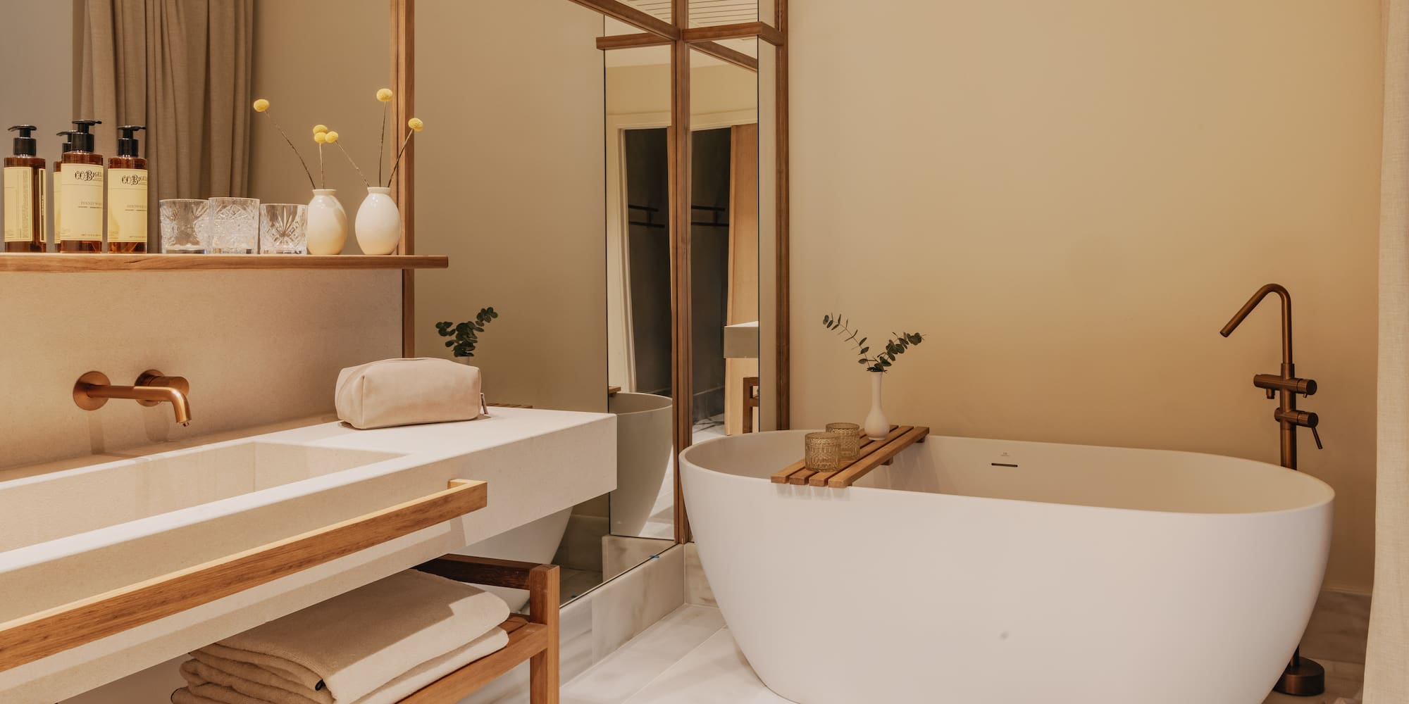 a bathroom with a tub and sink