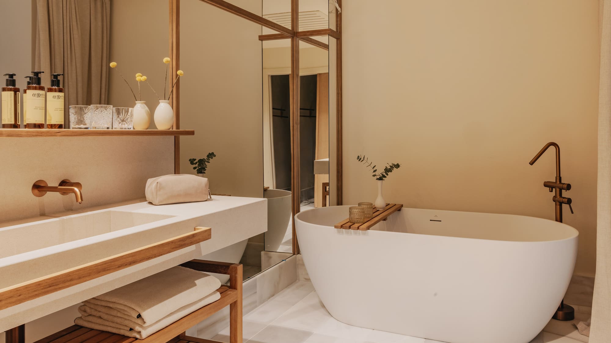 a bathroom with a tub and sink