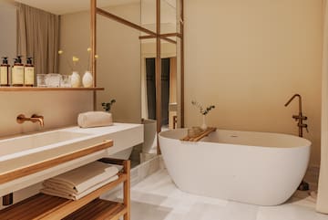 a bathroom with a tub and sink