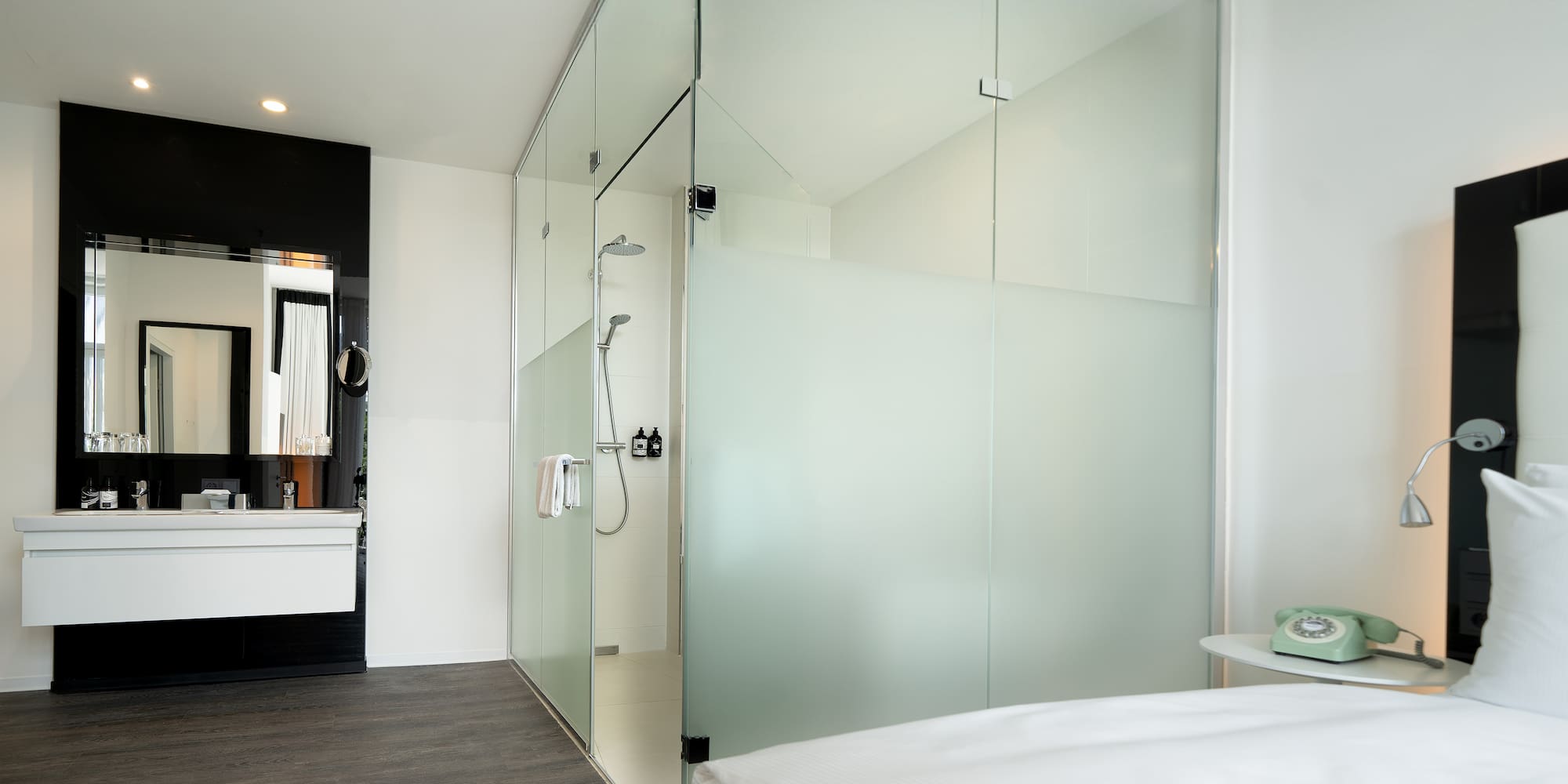 a glass shower door in a bathroom