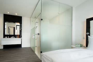 a glass shower door in a bathroom