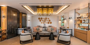 a room with a couch and tables