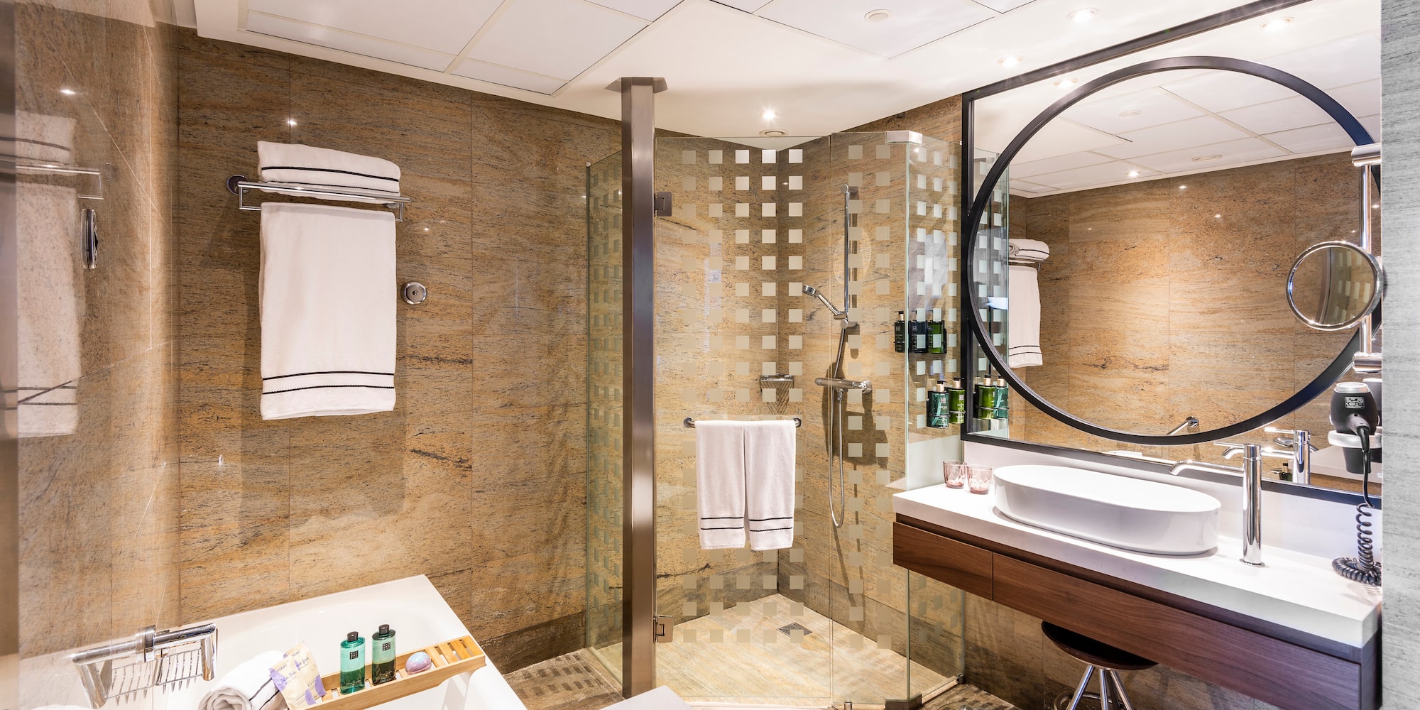 a bathroom with a shower and sink