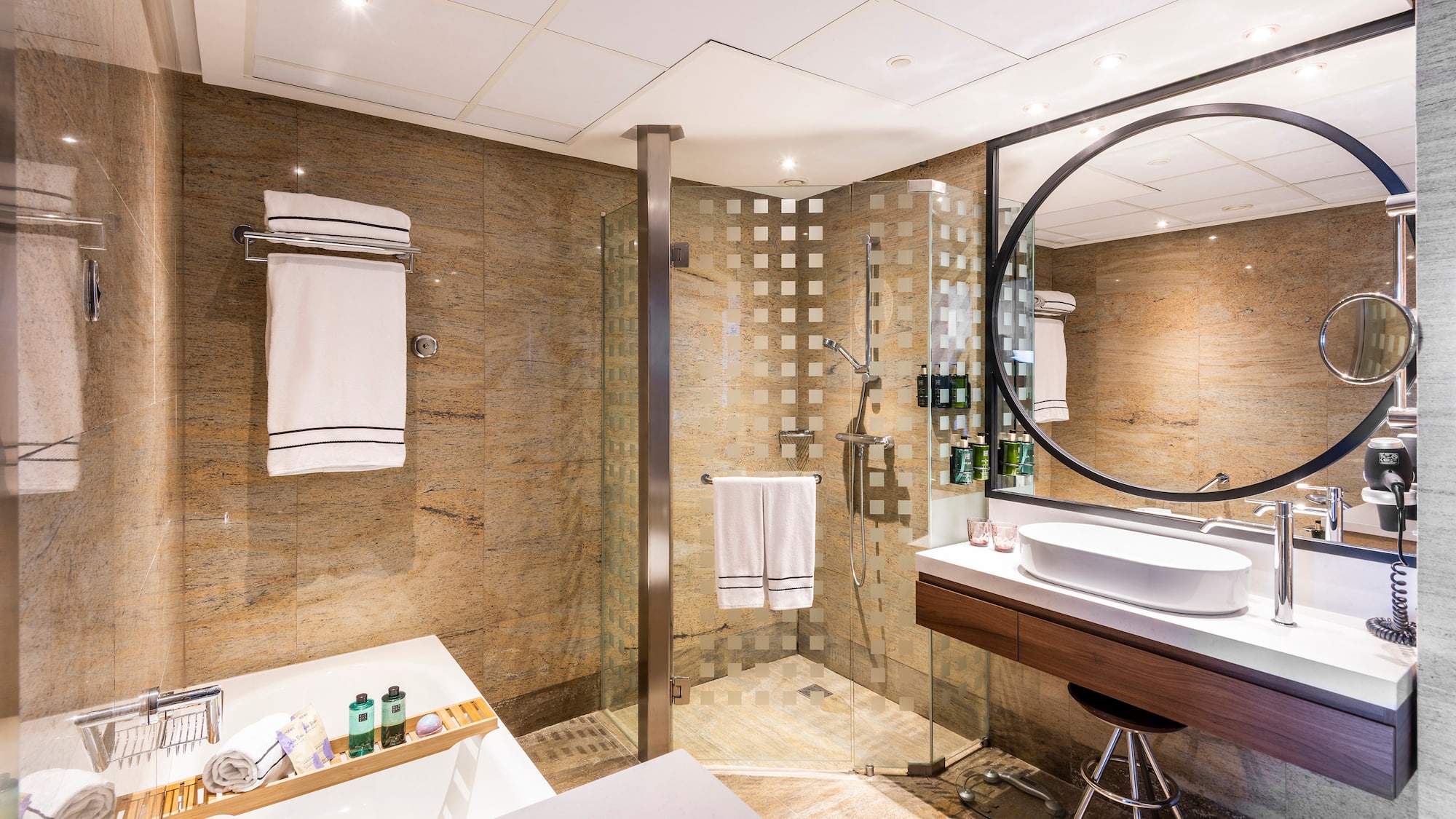 a bathroom with a shower and sink