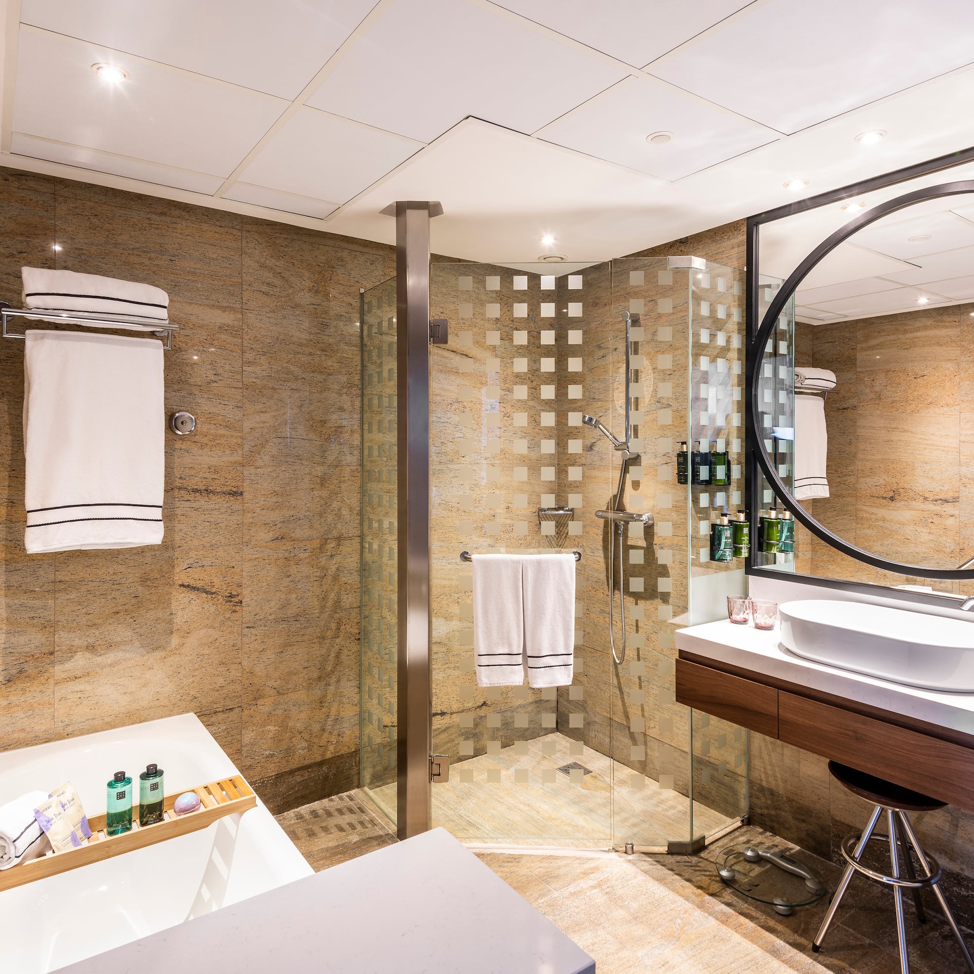 a bathroom with a shower and sink