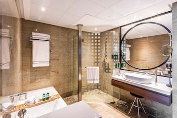 a bathroom with a shower and sink