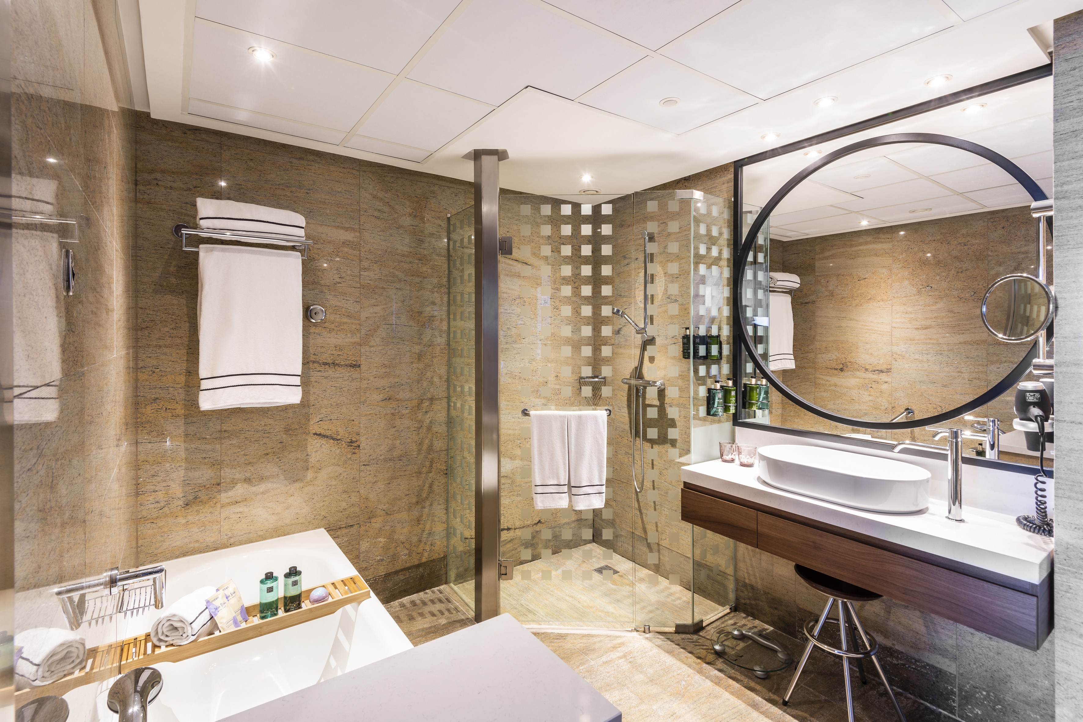 a bathroom with a shower and sink