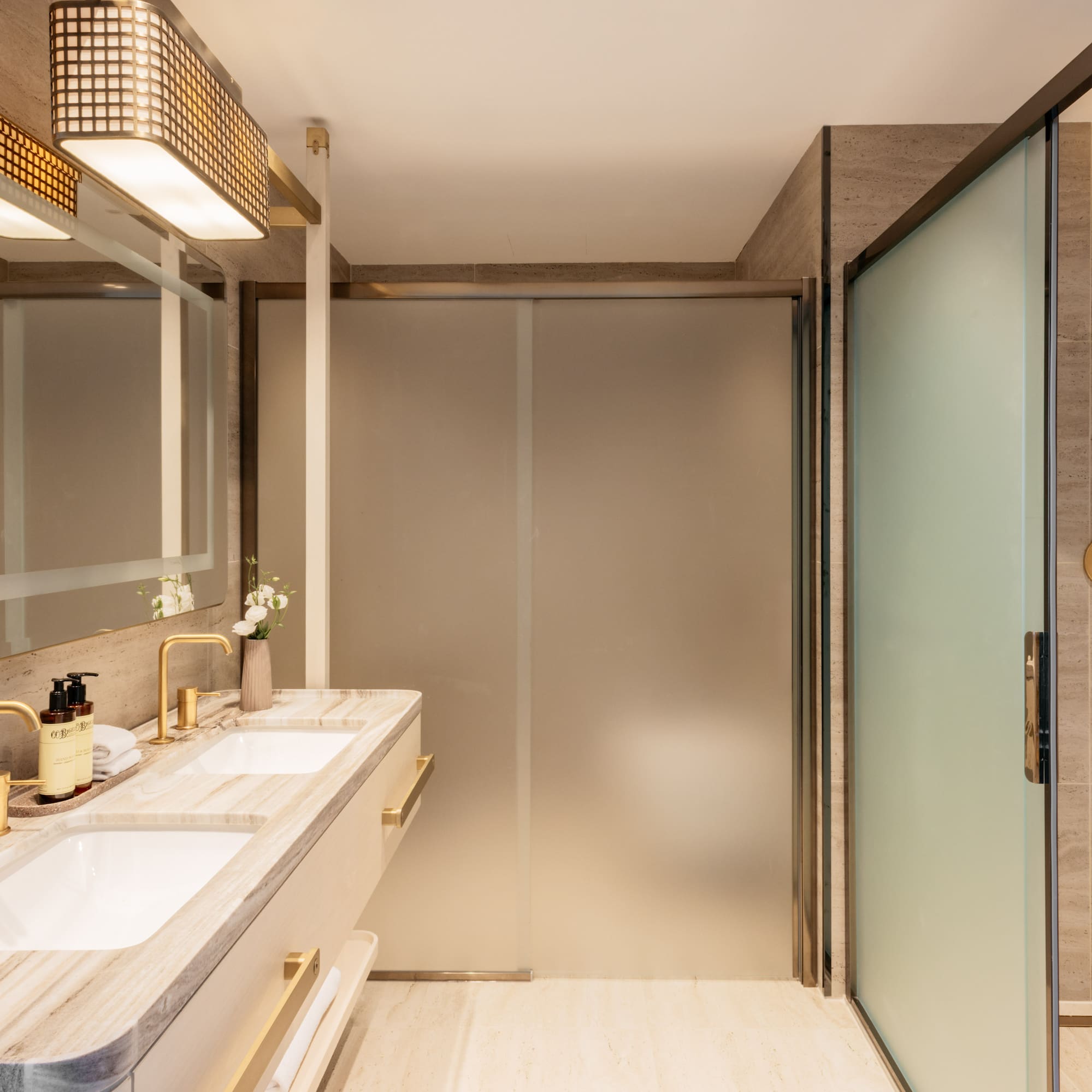 a bathroom with a shower and sink