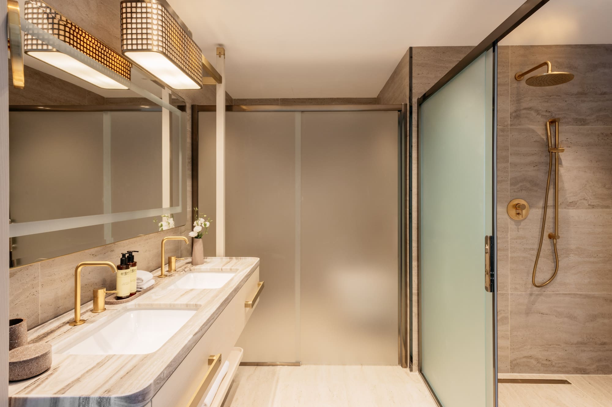 a bathroom with a shower and sink