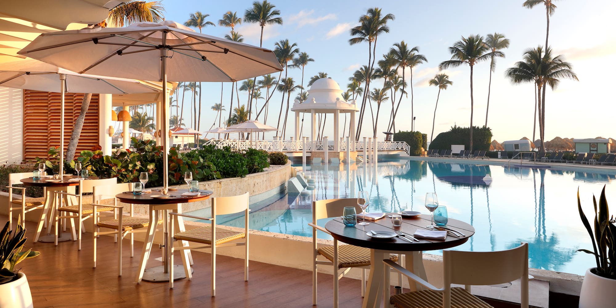 a pool with tables and chairs