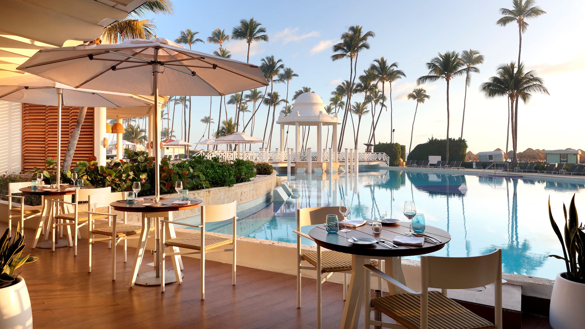 a pool with tables and chairs