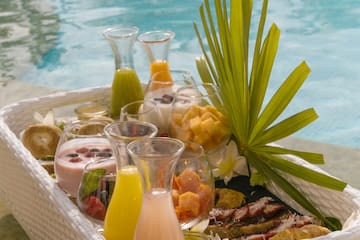 a tray of fruit and juices