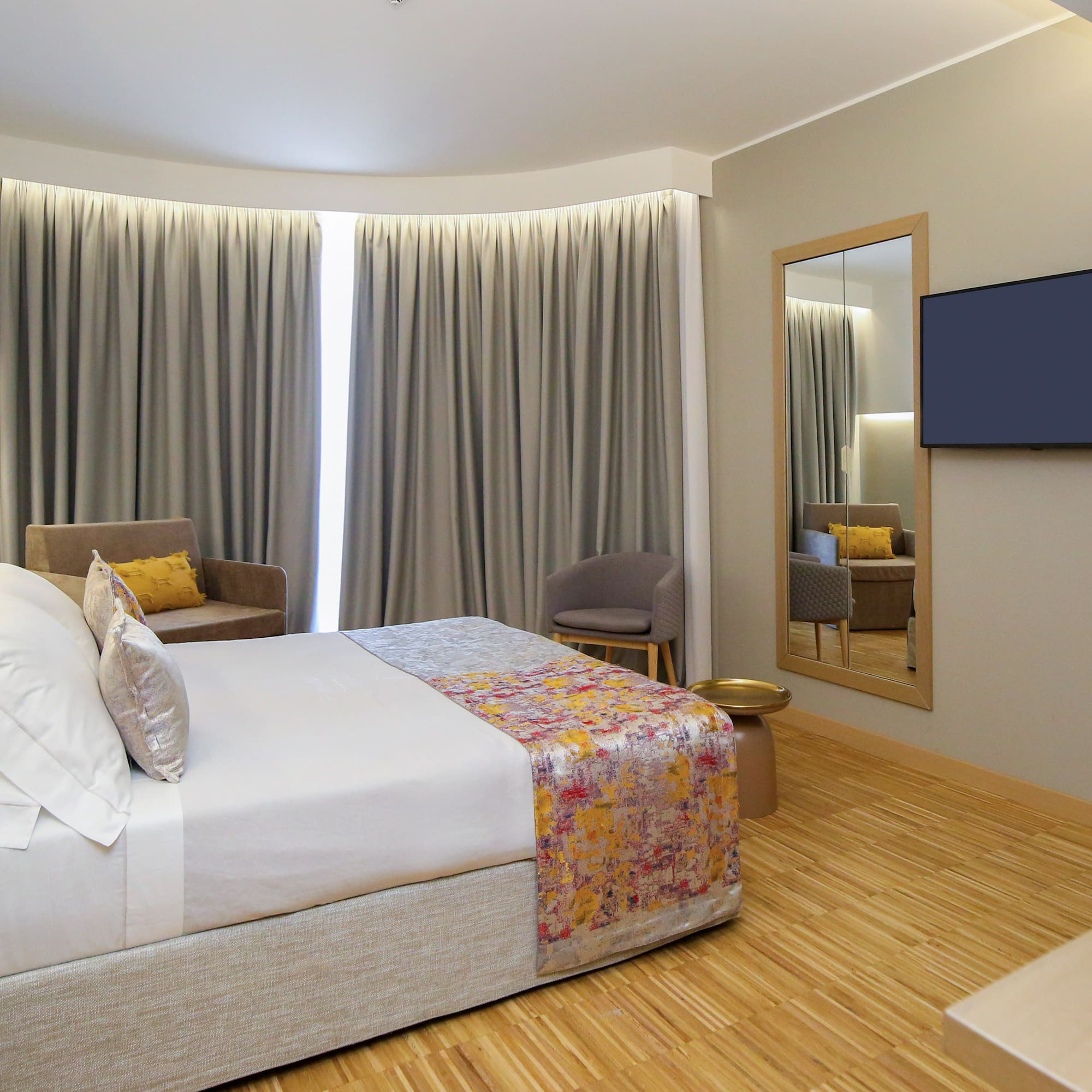 a room with a bed and a mirror