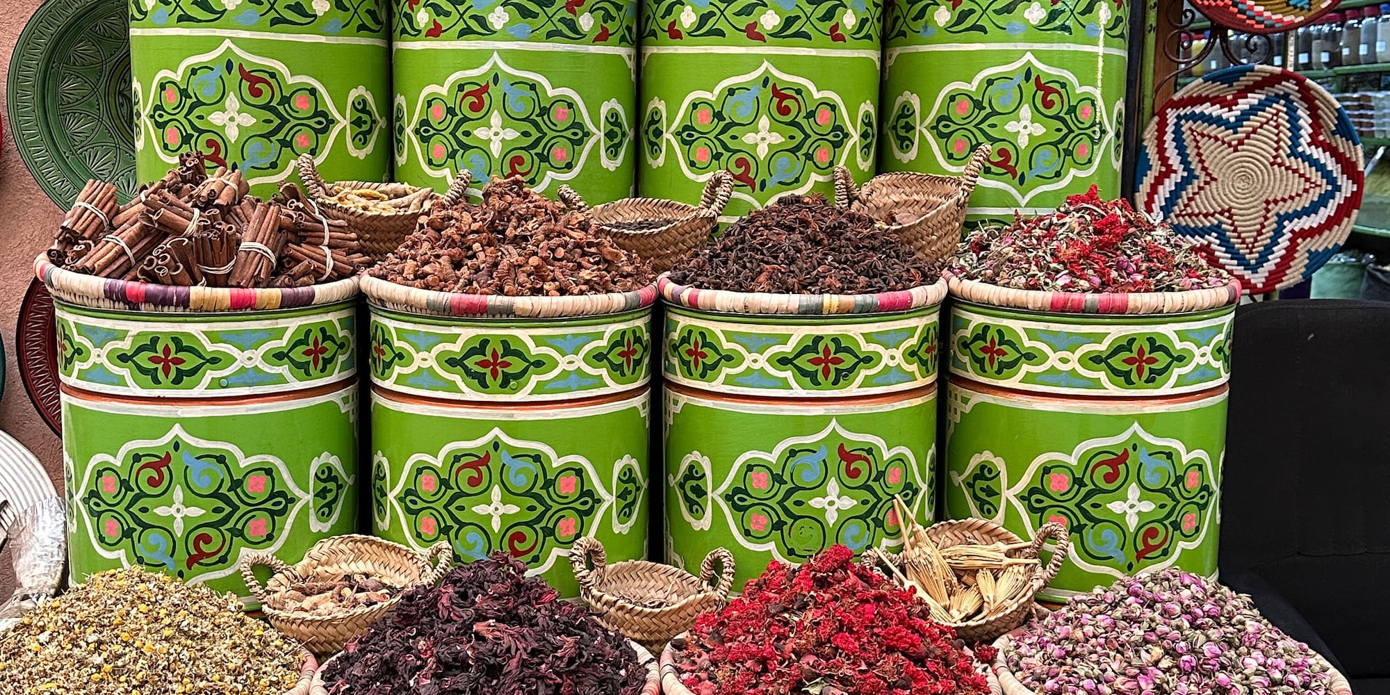a group of green containers with different colored herbs