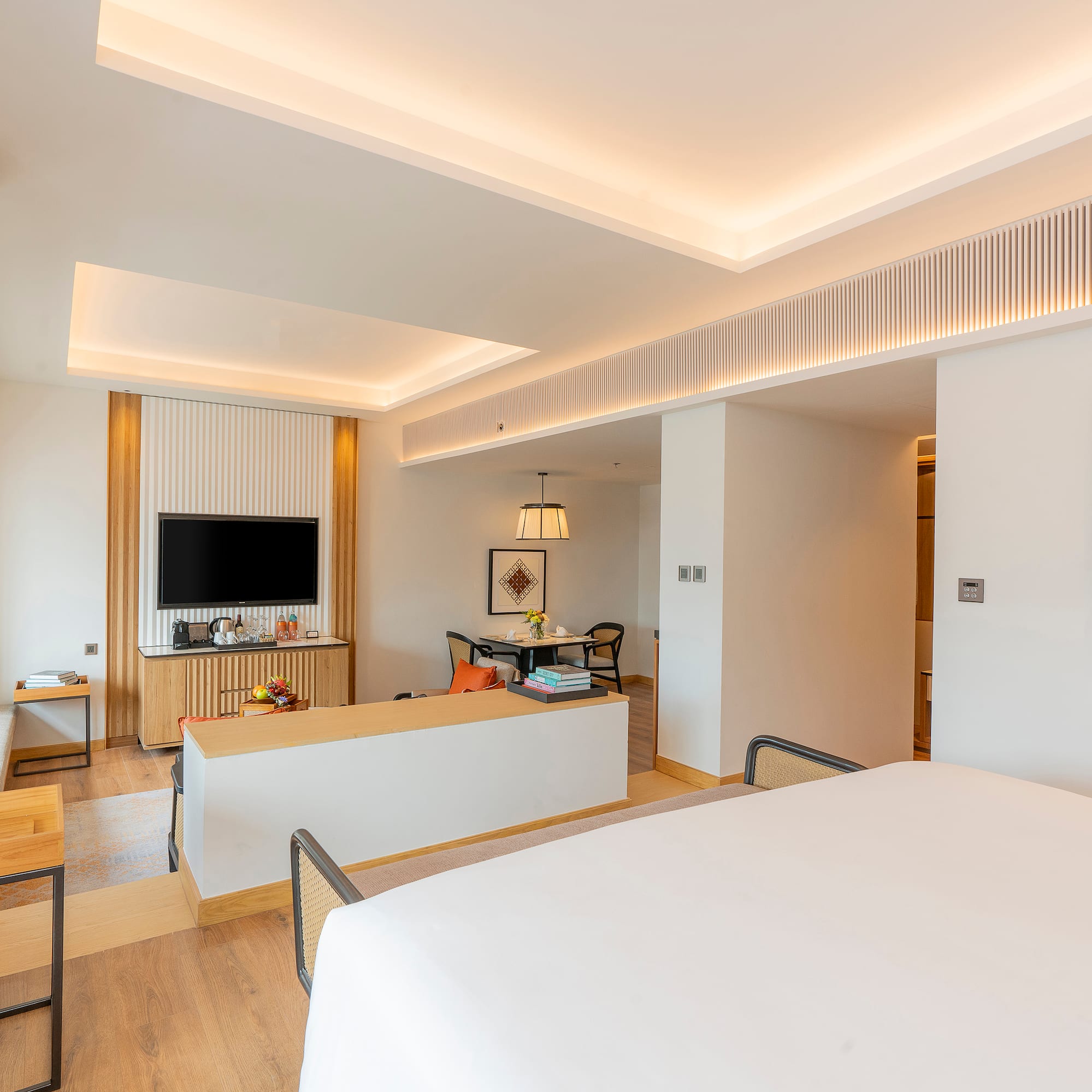 a room with a bed and a tv