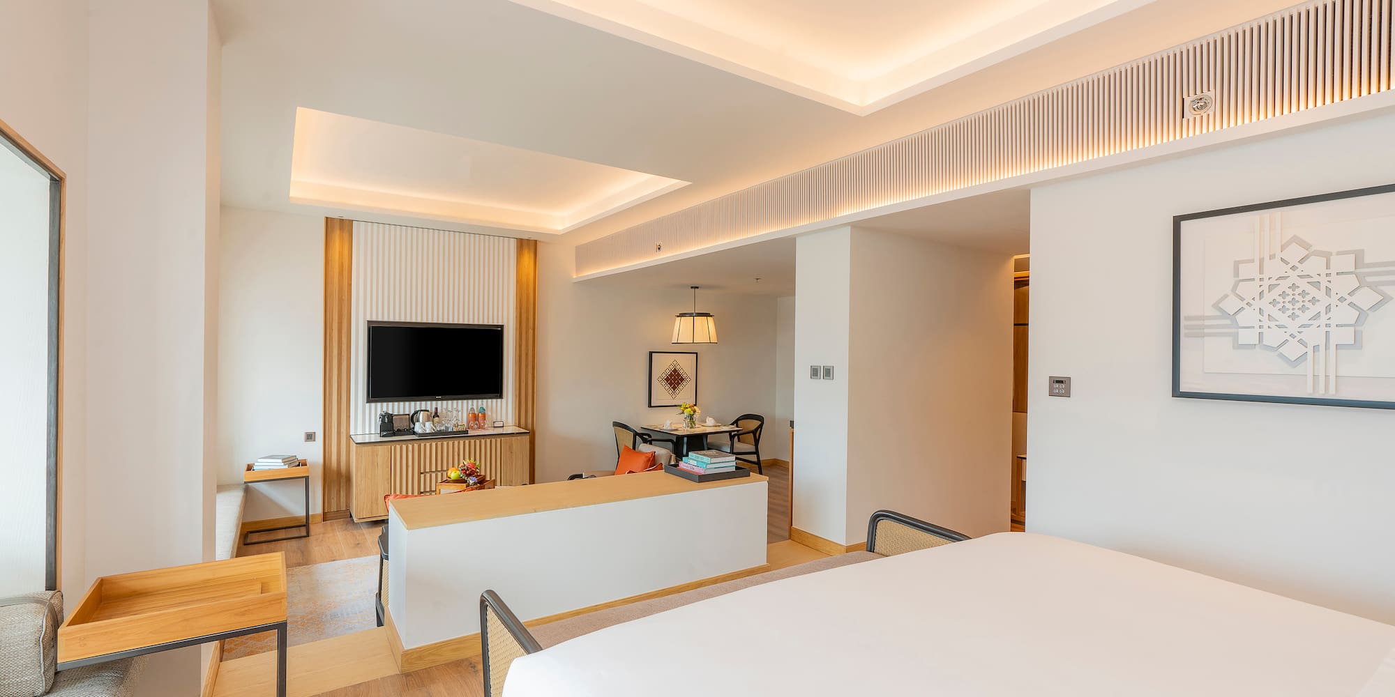 a room with a bed and a tv