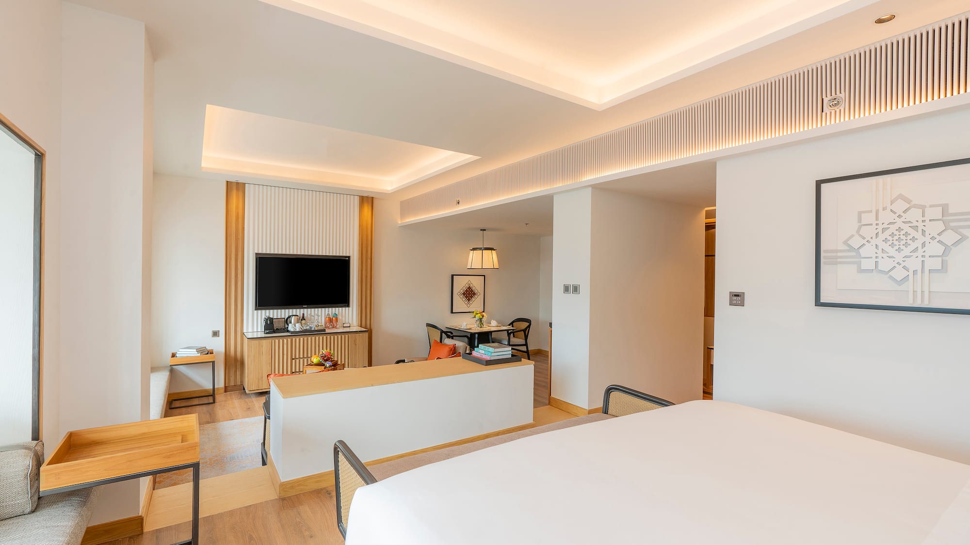 a room with a bed and a tv