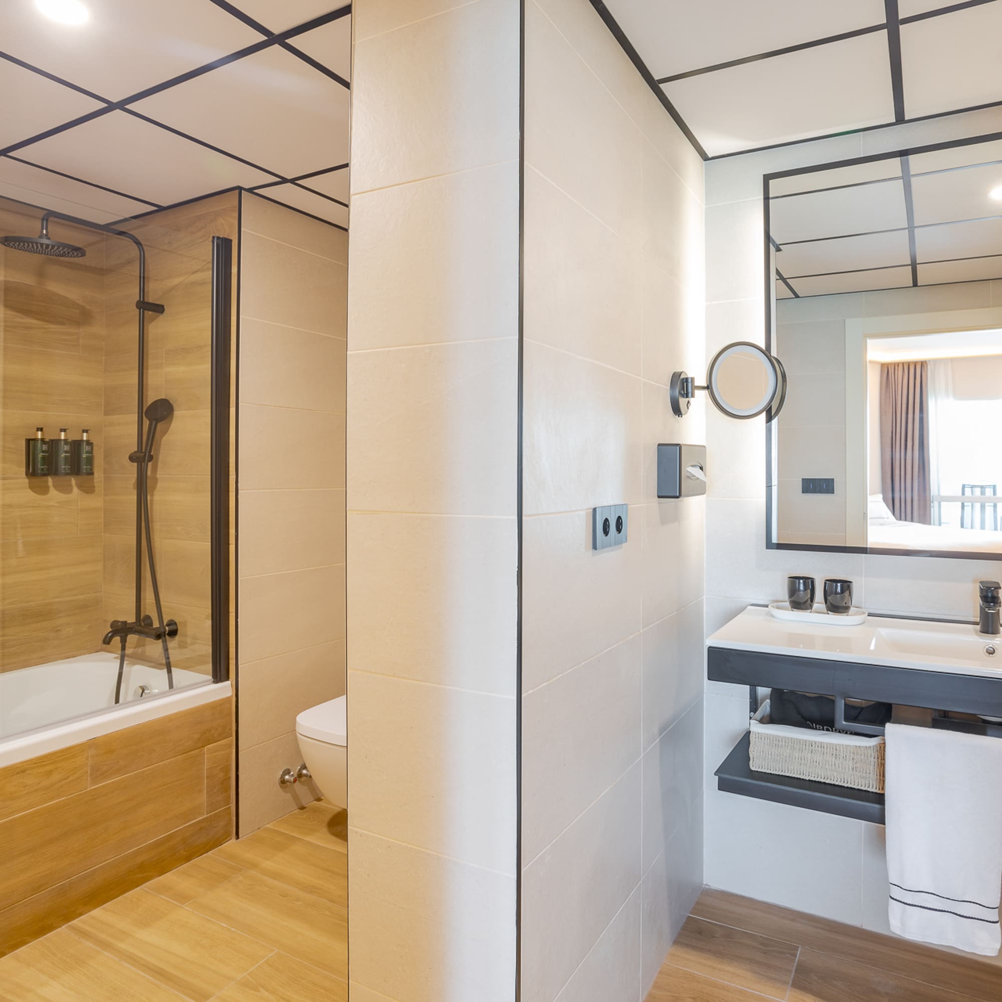 a bathroom with a wood floor and a shower