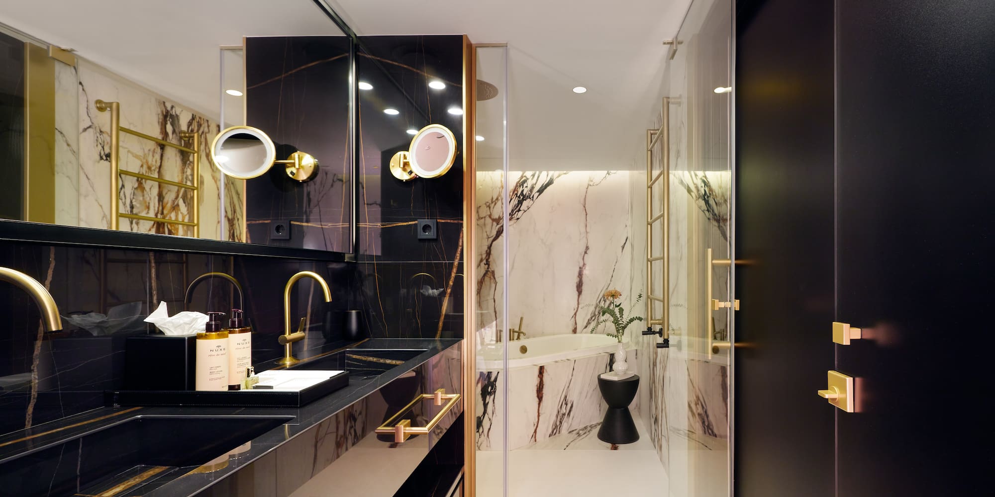 a bathroom with a marble shower and sink