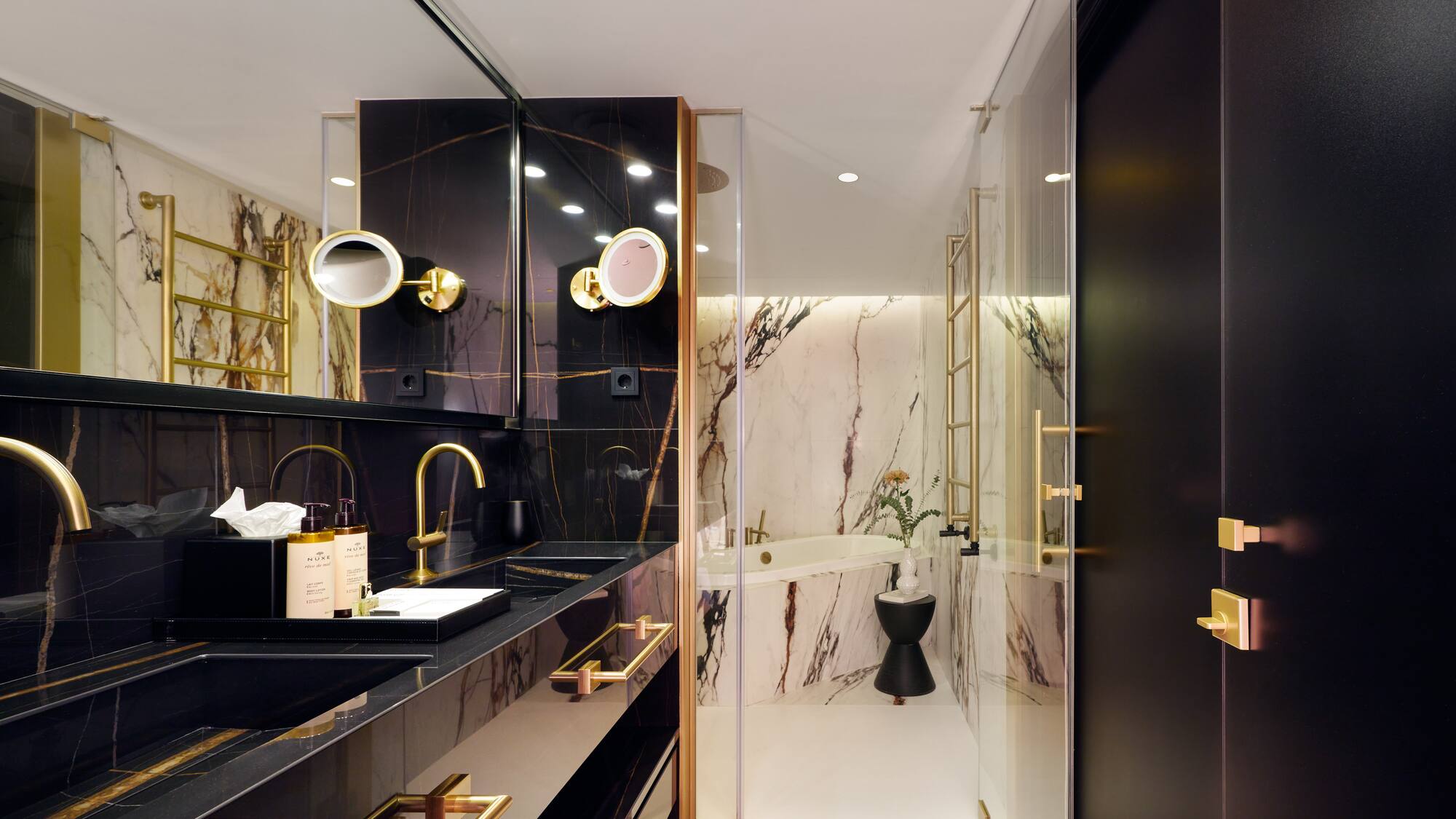 a bathroom with a marble shower and sink