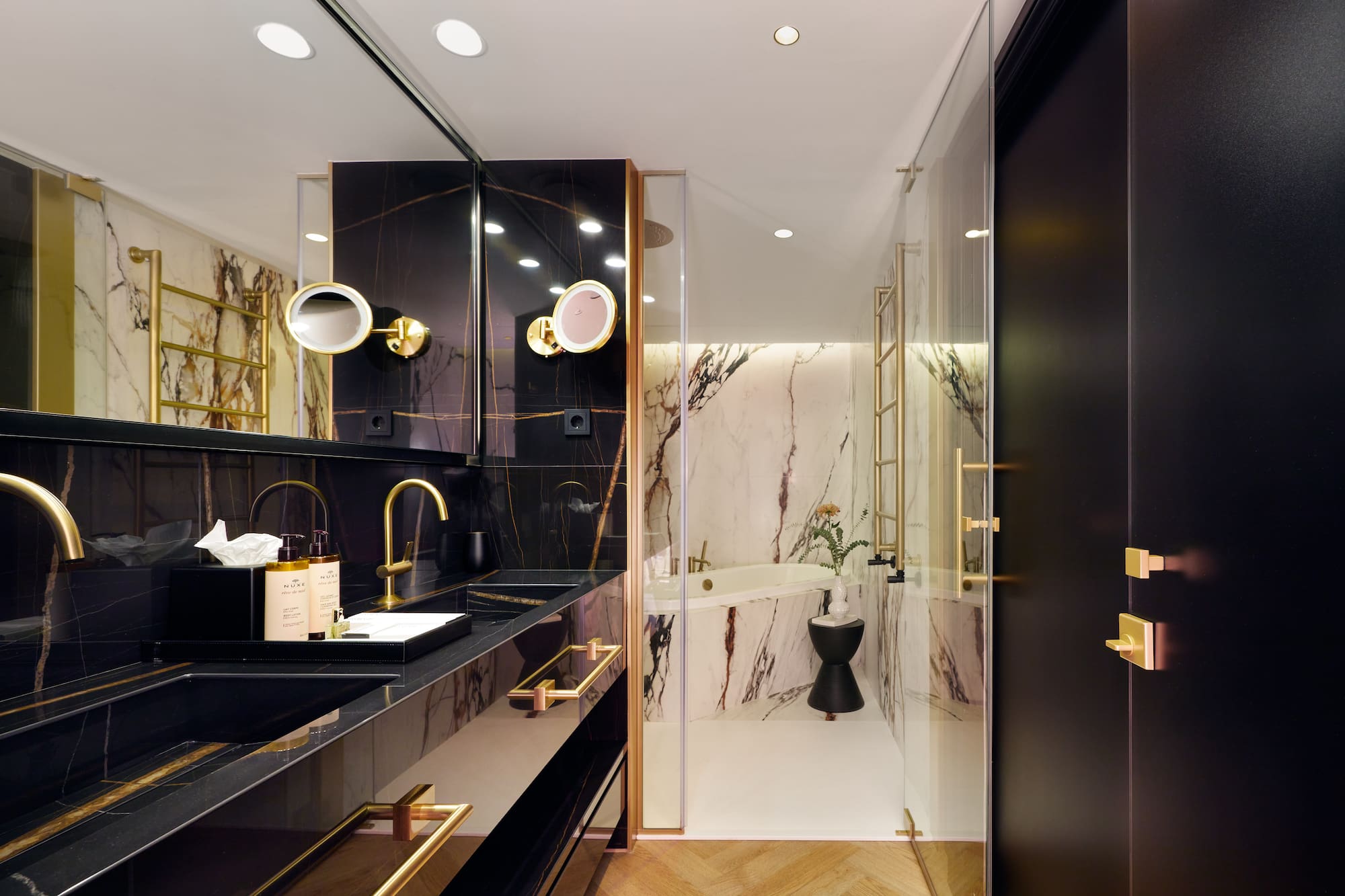 a bathroom with a marble shower and sink