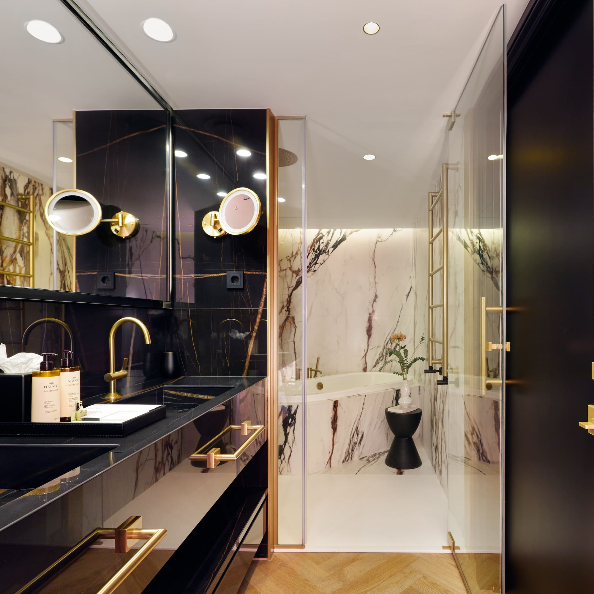 a bathroom with a marble shower and sink