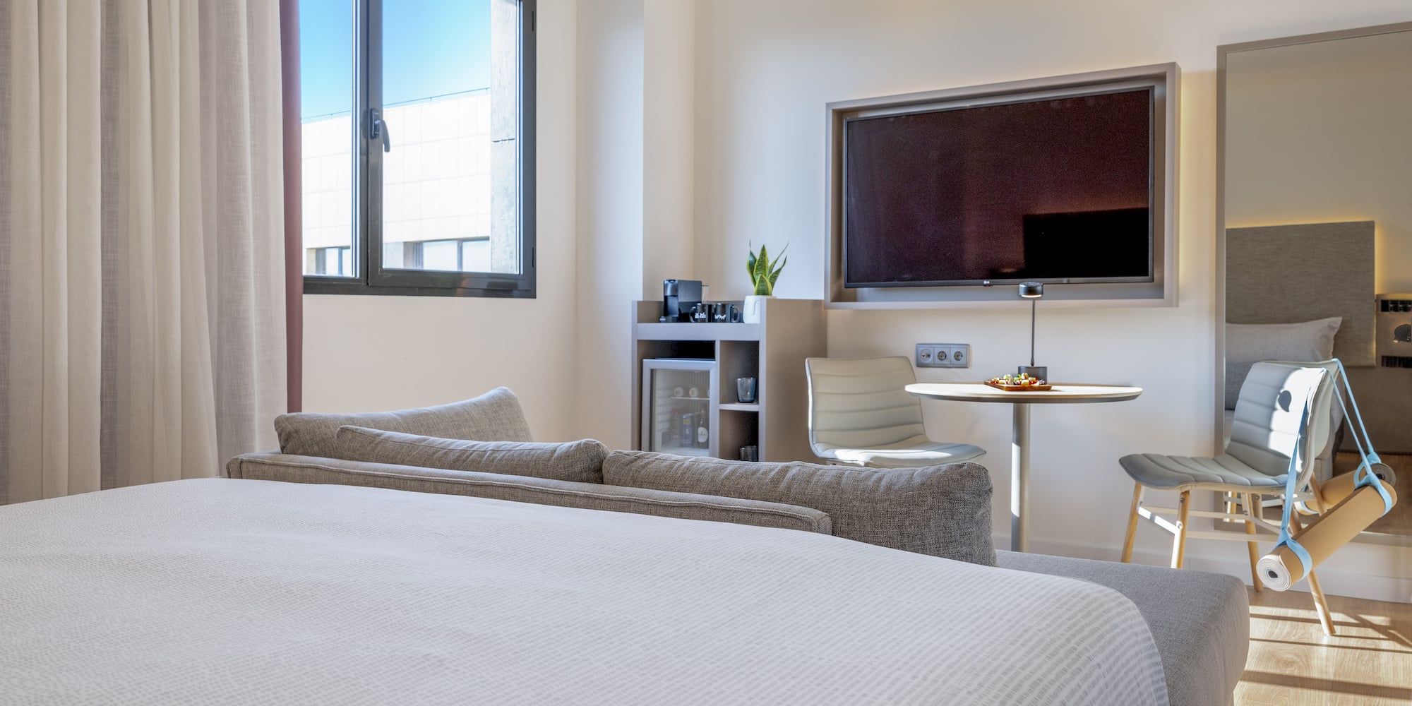 a room with a bed and a tv